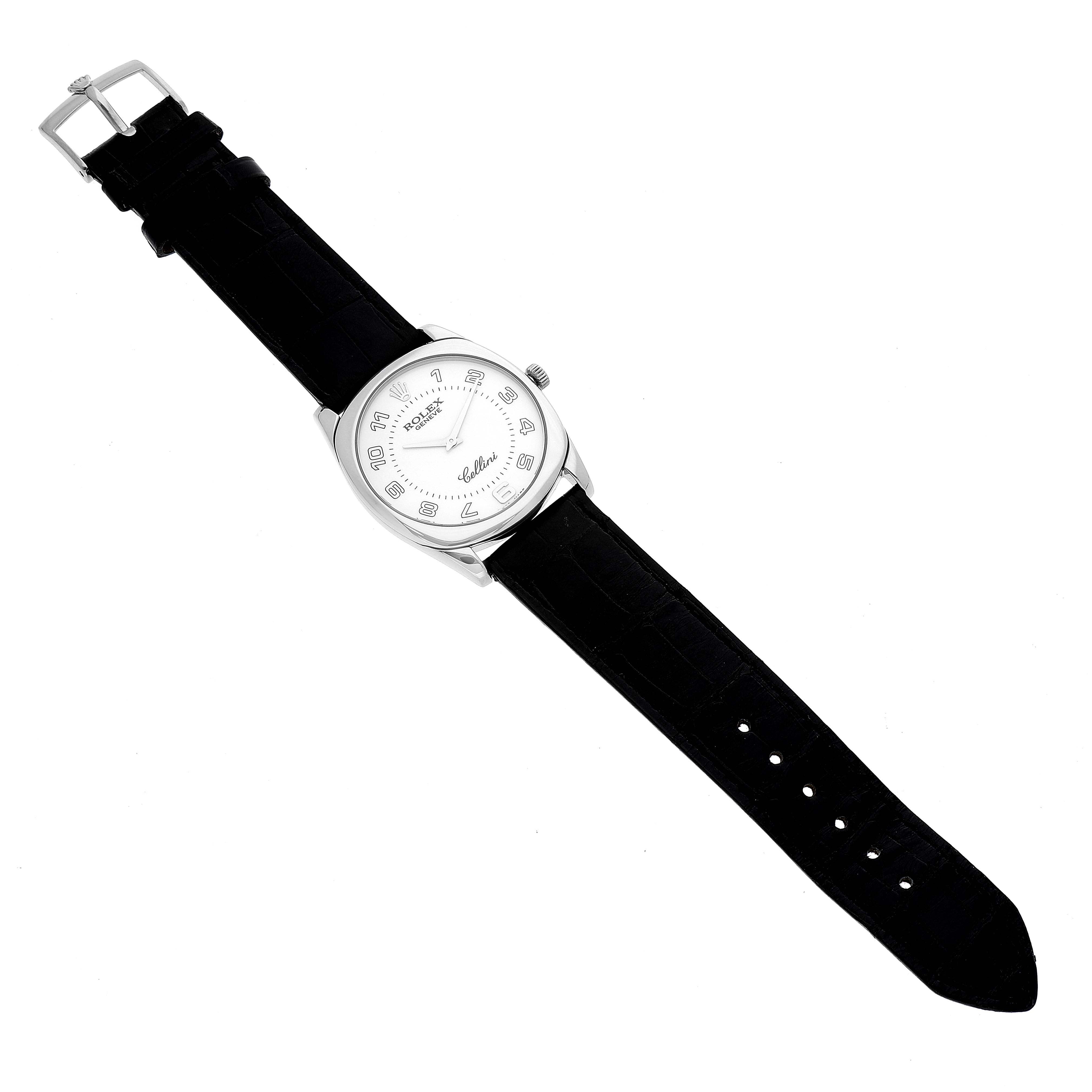 The Rolex Cellini 4233 Men
s White Gold Black Dial 4233 Men
s White Gold Black Dial watch is shown from a top-down angle, displaying its dial, case, crown, and leather strap.