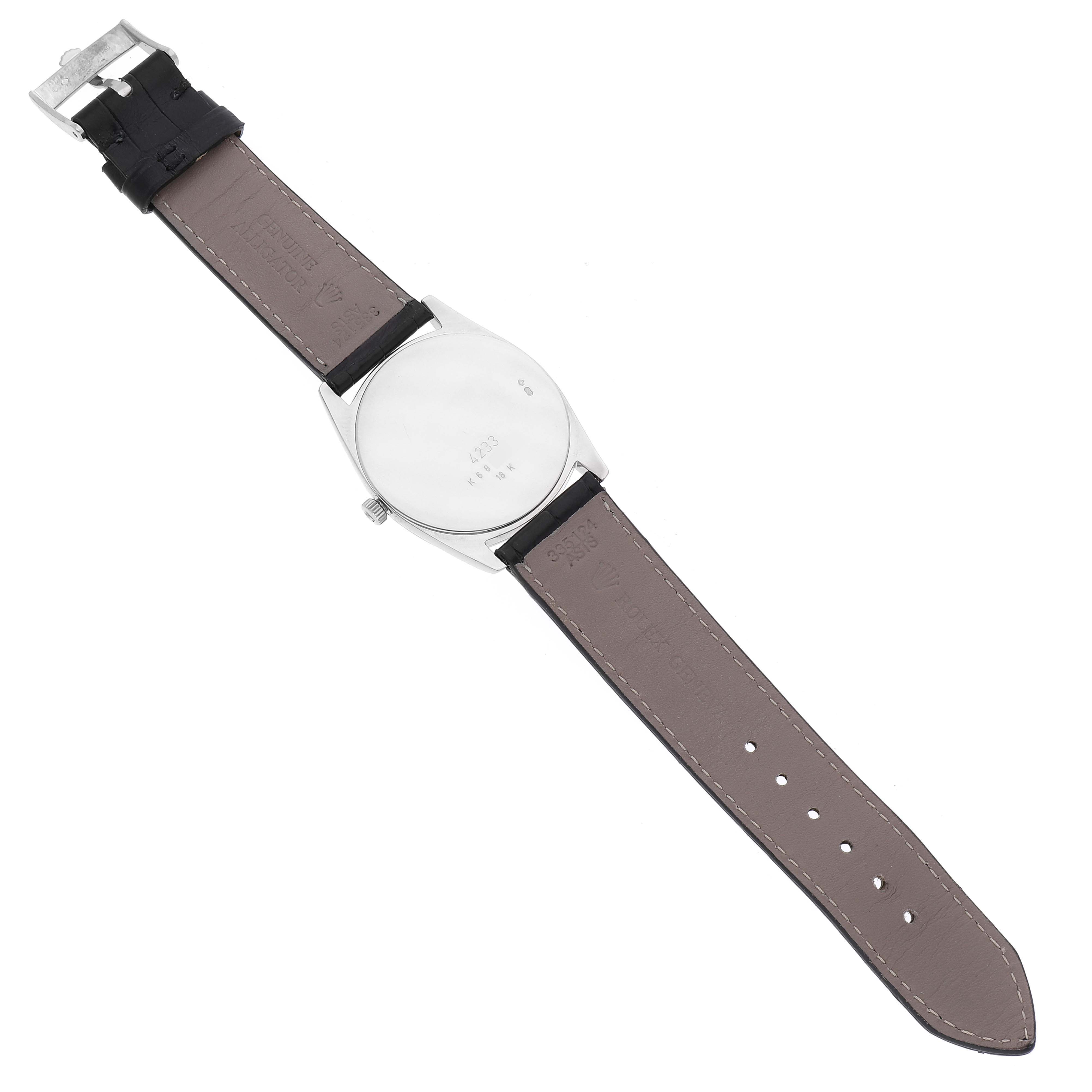 The image shows the back of a Rolex Cellini 4233 Men
s White Gold Black Dial 4233 Men
s White Gold Black Dial watch, highlighting the leather strap and caseback.