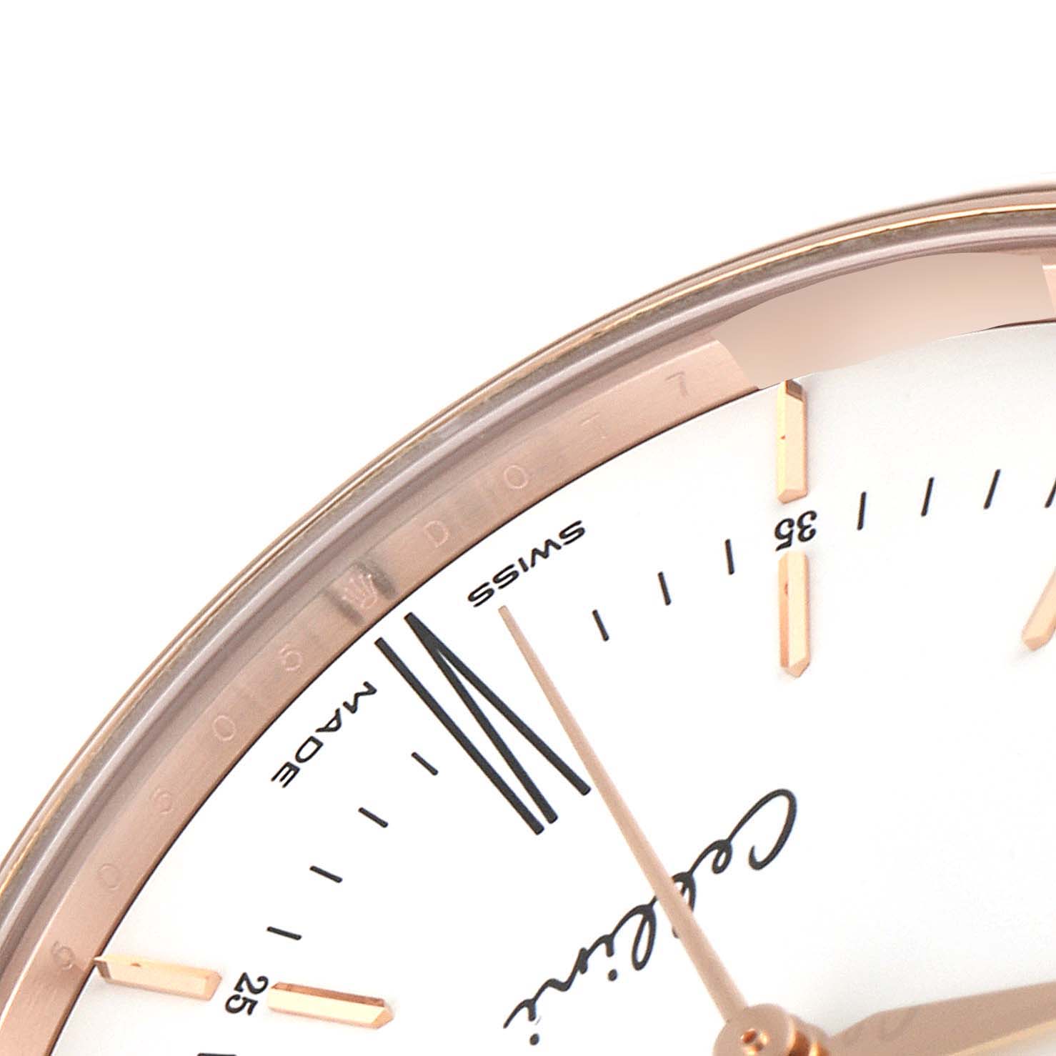 The image shows the upper right portion of a Rolex Cellini 50505 Men
s Rose Gold White Dial 50505 Men
s Rose Gold White Dial watch dial, focusing on the markings and part of the hands.