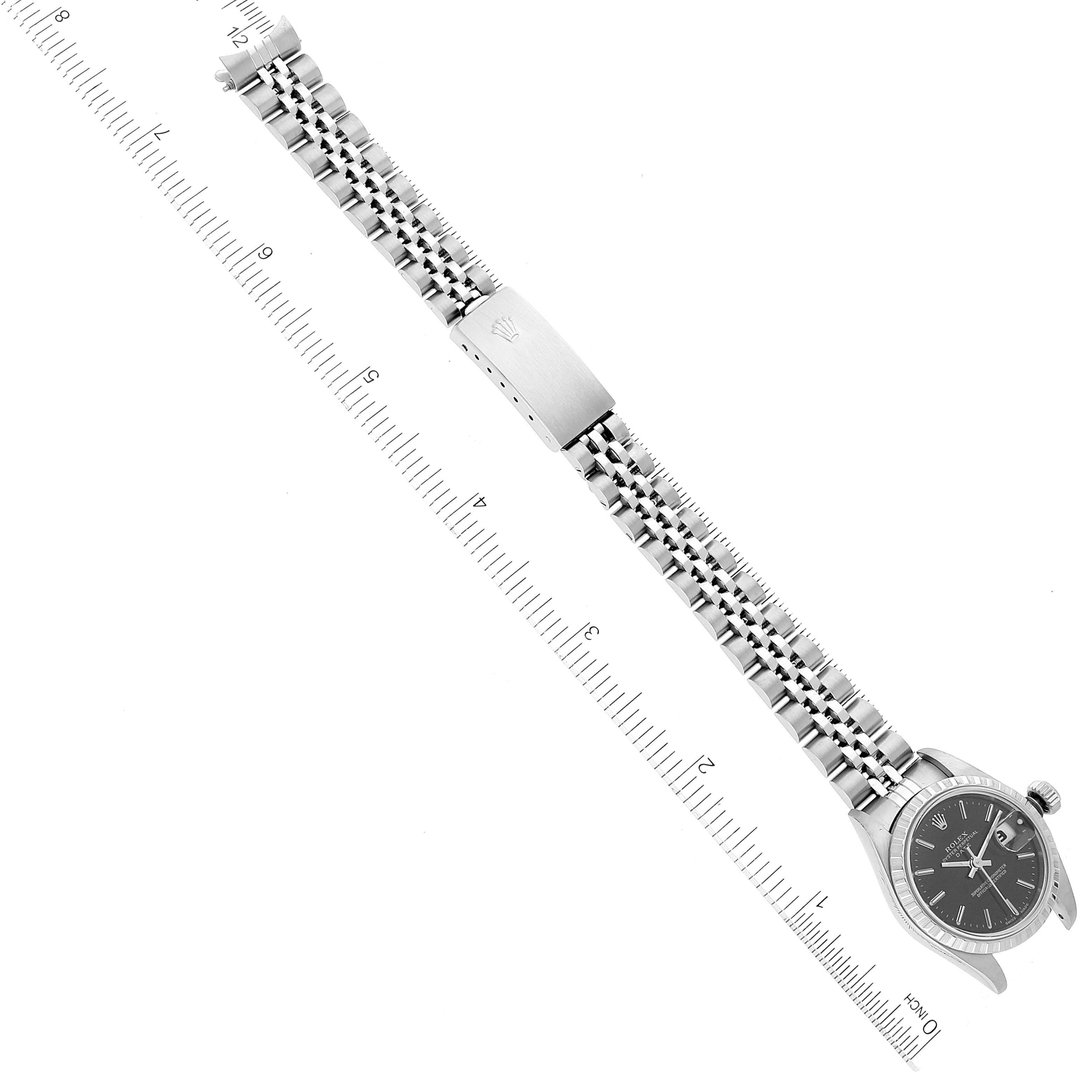 The image shows a top-down view of a Rolex Date 79240 Women's Stainless Steel Black Dial 79240 Women's Stainless Steel Black Dial model watch, including the face, bracelet, and clasp.