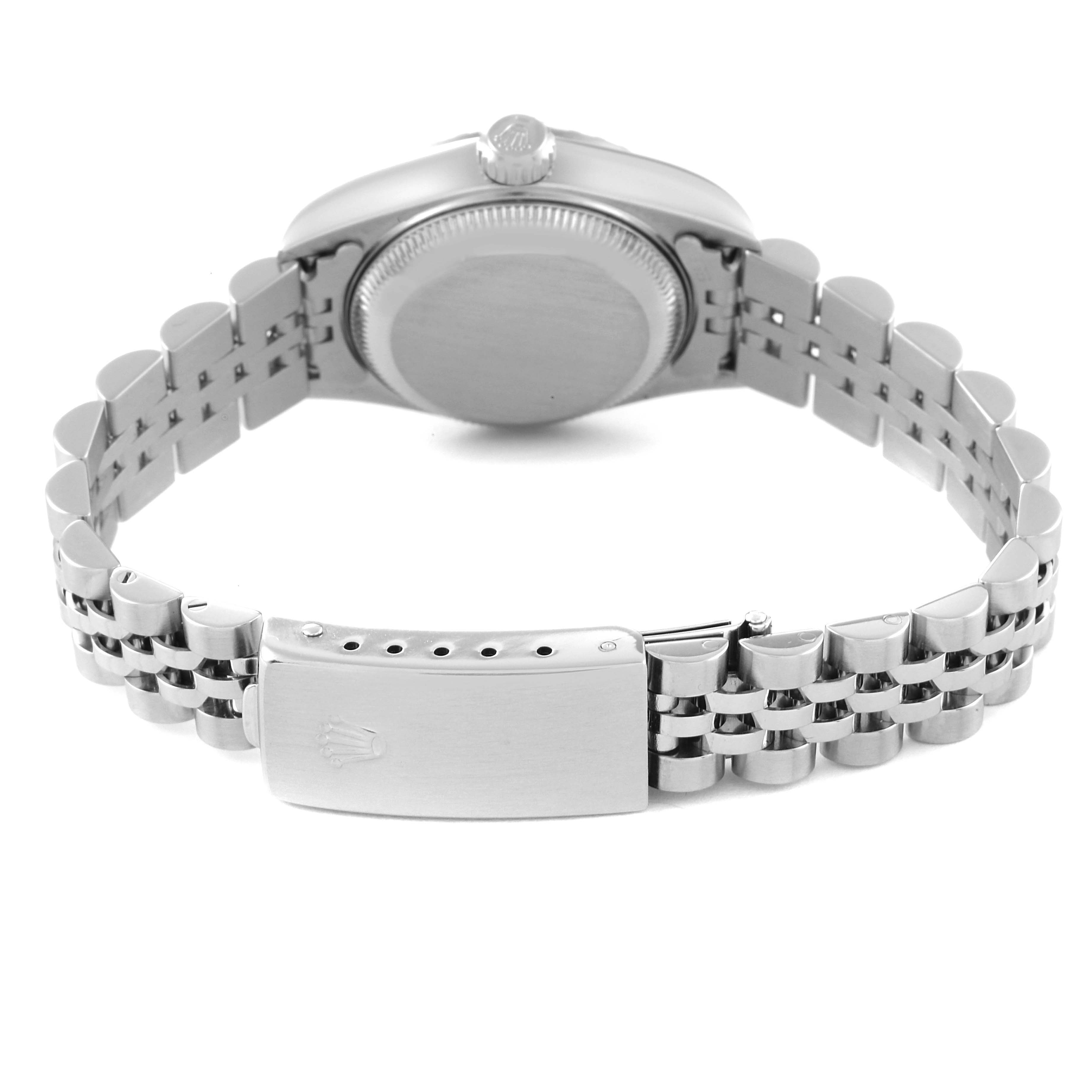 The image shows the back of a Rolex Date 79240 Women's Stainless Steel Black Dial 79240 Women's Stainless Steel Black Dial model watch, highlighting its case back, crown, and bracelet clasp.