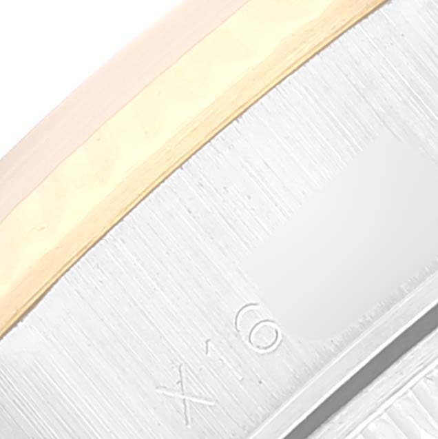 This image shows a close-up of the side of a Rolex Datejust 69173 Women's Steel and Gold (two tone) Black Dial 69173 Women's Steel and Gold (two tone) Black Dial watch case with part of the engraved model number.