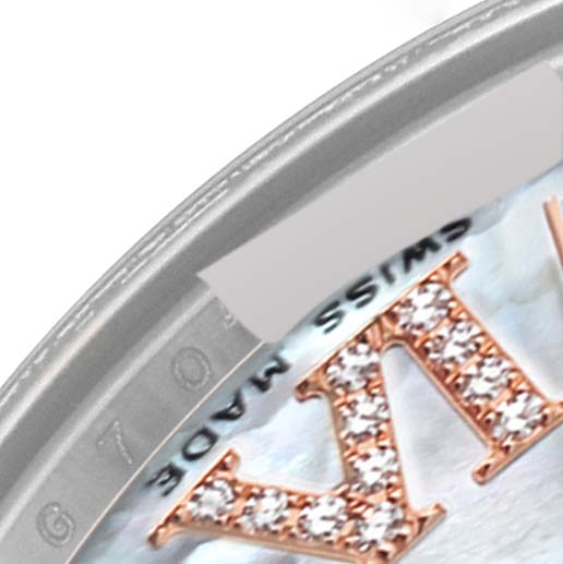 This close-up image of a Rolex Mid-Size 178341 Women's Steel and Gold (two tone) Mother of Pearl Dial 178341 Women's Steel and Gold (two tone) Mother of Pearl Dial model watch shows a portion of the dial with diamond-set Roman numerals and part of the bezel.