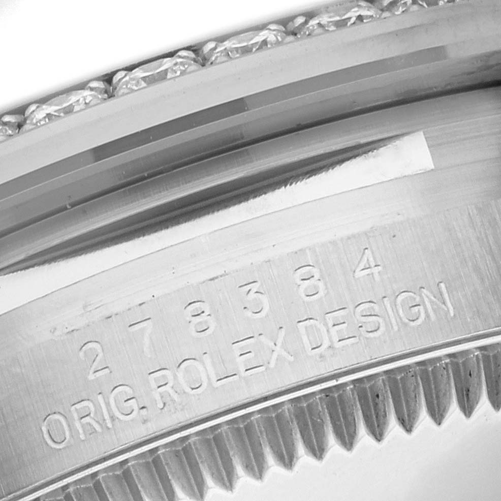 The image shows a close-up of the case side engraving of a Mid-Size Rolex watch, displaying the serial number and "ORIG. ROLEX DESIGN."