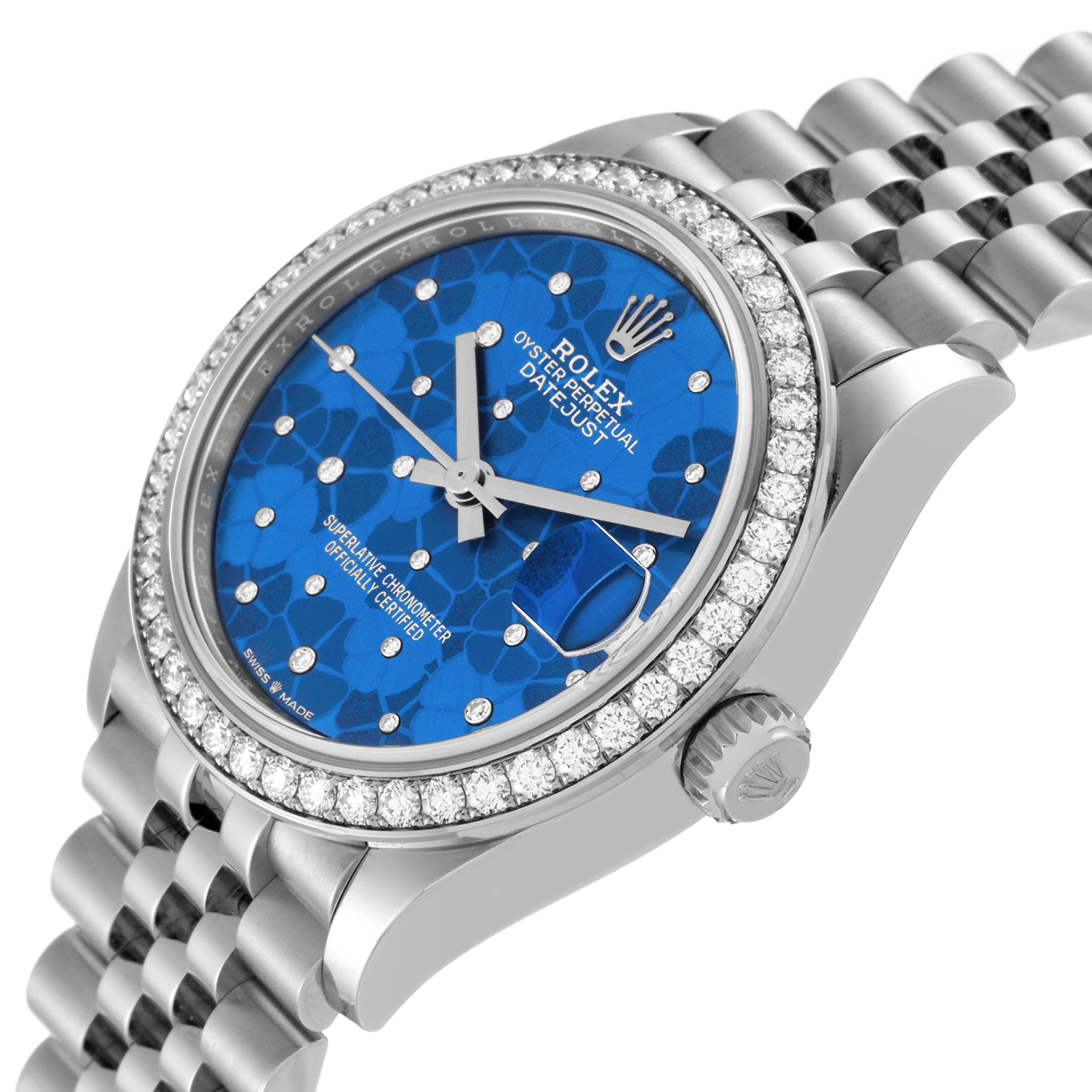 The image shows a Rolex Mid-Size 278384 Women
s Stainless Steel Blue Dial 278384 Women
s Stainless Steel Blue Dial Datejust watch, viewed from an angled side, highlighting the bracelet, blue dial, diamond bezel, and crown.