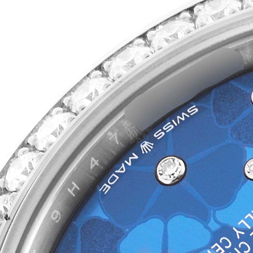 This close-up image shows the bezel and dial of a Rolex Mid-Size 278384 Women
s Stainless Steel Blue Dial 278384 Women
s Stainless Steel Blue Dial watch, highlighting the "Swiss Made" text and diamond markers.