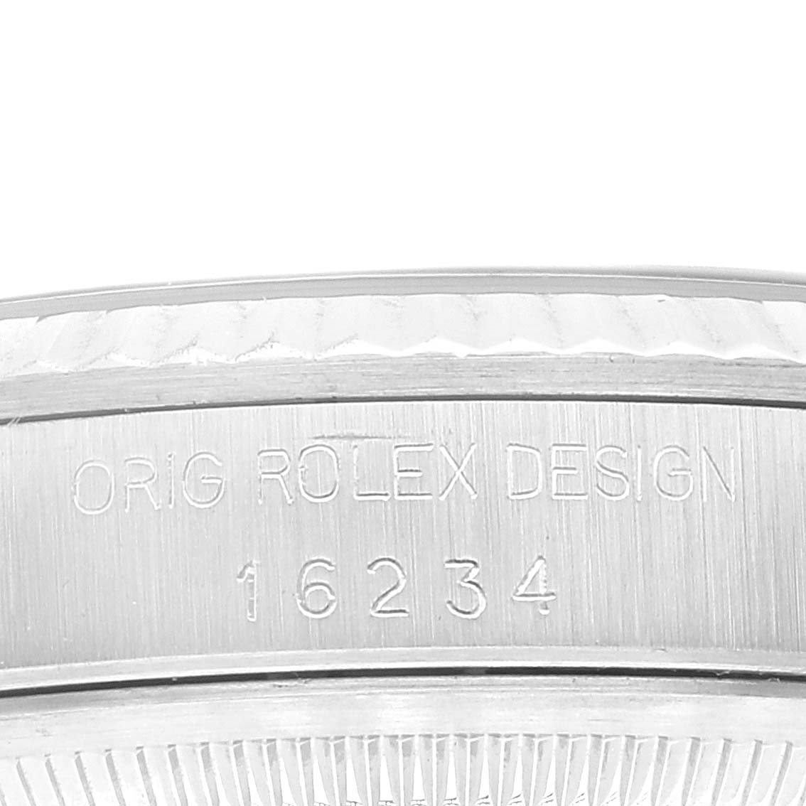 This image shows a close-up of the engraved side of the bezel on a Rolex Datejust 16234 Men's Stainless Steel Black Dial 16234 Men's Stainless Steel Black Dial model.