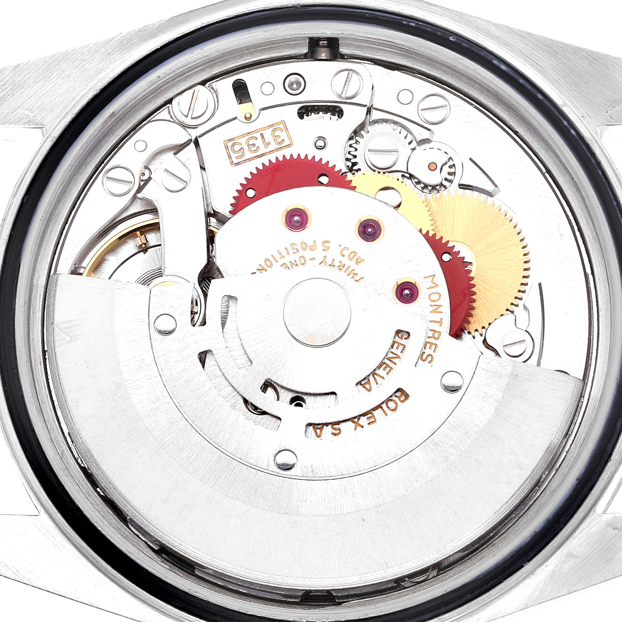 The image shows the internal mechanism of a Rolex Datejust 16234 Men's Stainless Steel Black Dial 16234 Men's Stainless Steel Black Dial watch, highlighting gears and the intricate watch movement components.