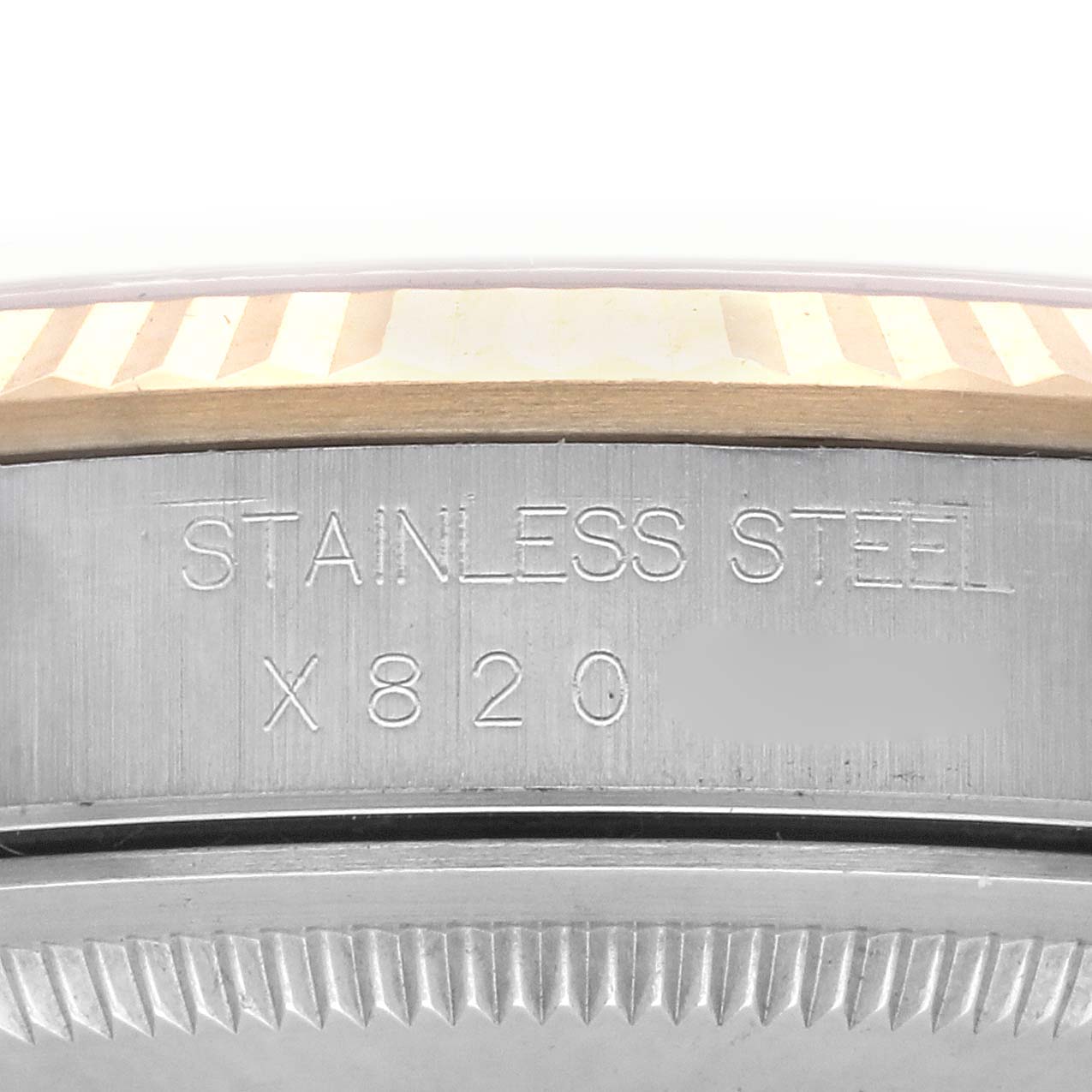 The image shows a close-up of the side of a Rolex Datejust 16233 Men's Steel and Gold (two tone) Champagne Dial 16233 Men's Steel and Gold (two tone) Champagne Dial watch, highlighting the stainless steel case and part of the bezel.