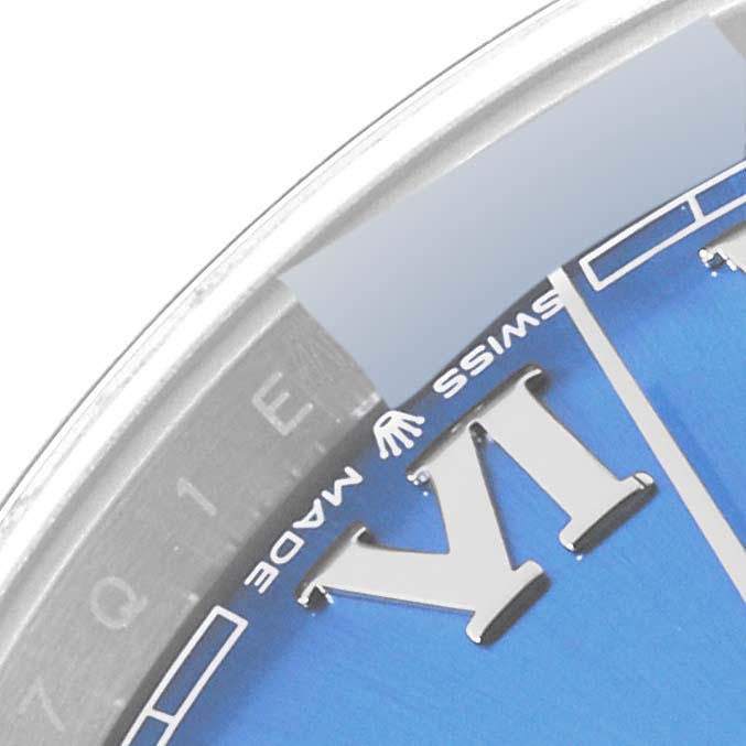 The image shows an angled close-up of the dial and part of the bezel of a Rolex Datejust 41 126300 Men
s Stainless Steel Blue Dial 126300 Men
s Stainless Steel Blue Dial watch.