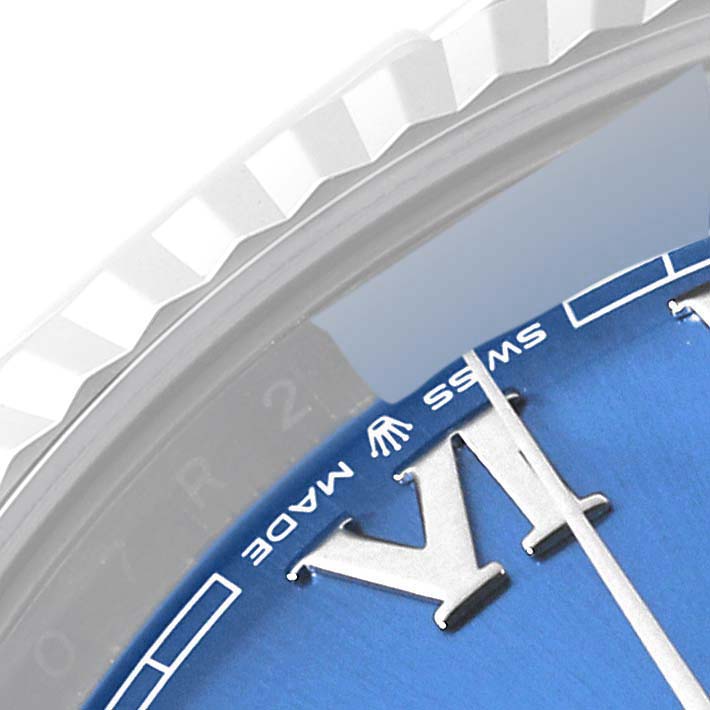 The image shows the top view of the bezel and dial of a Rolex Datejust 41 126334 Men's Stainless Steel Blue Dial 126334 Men's Stainless Steel Blue Dial, highlighting the "VI", "Swiss Made," and Rolex crown logo.