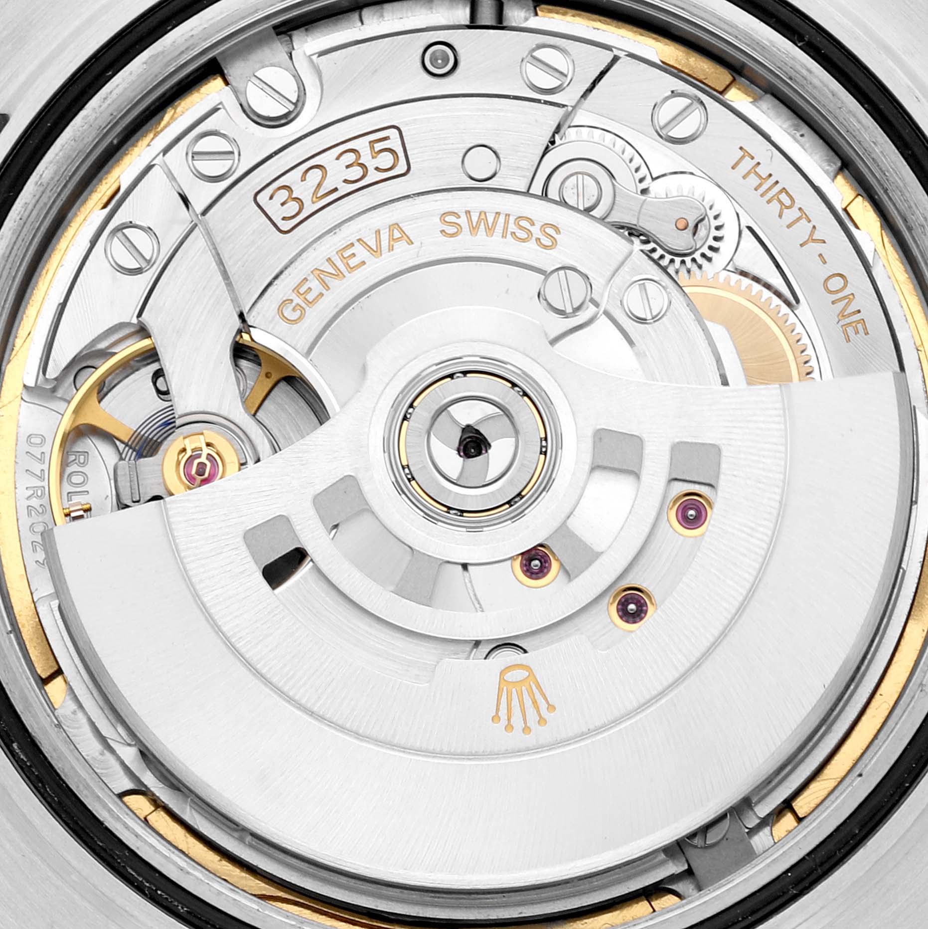 This is a close-up view of the Rolex Datejust 41 126334 Men's Stainless Steel Blue Dial 126334 Men's Stainless Steel Blue Dial movement, showing intricate internal mechanisms and engravings.