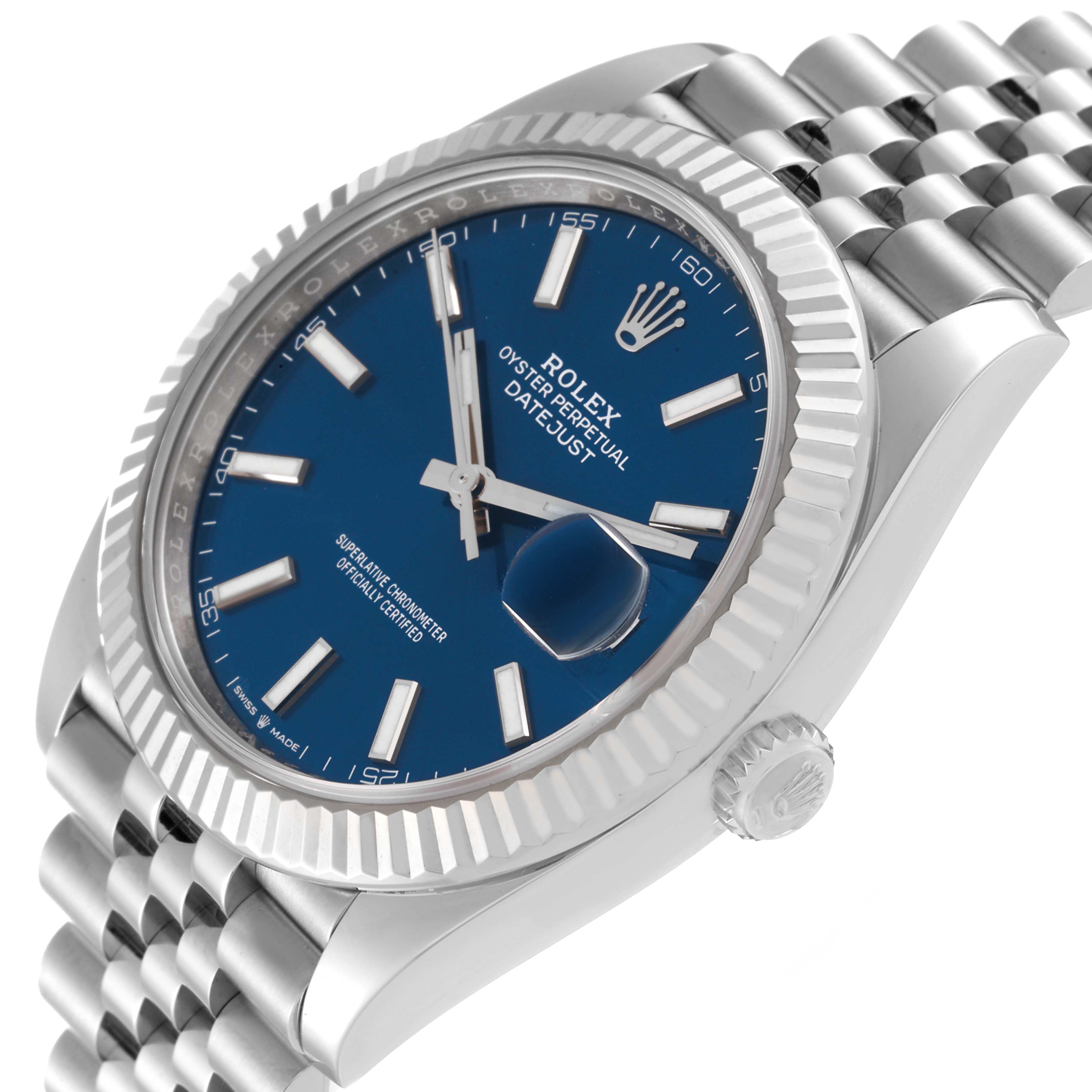 The image shows a side angle of the Rolex Datejust 41 126334 Men
s Stainless Steel Blue Dial 126334 Men
s Stainless Steel Blue Dial watch, highlighting its blue dial, fluted bezel, and Jubilee bracelet.