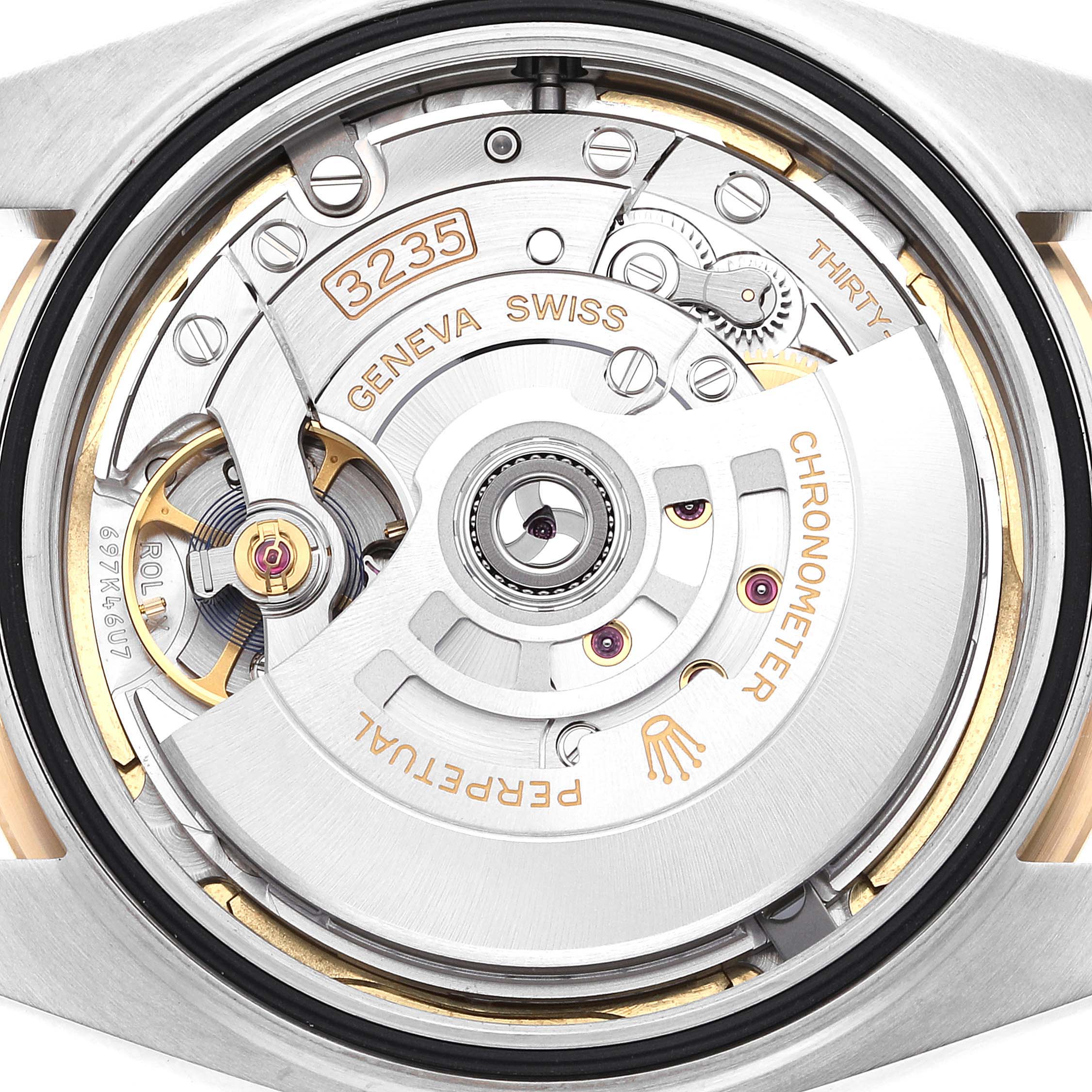 This image shows the movement mechanism of a Rolex Datejust 41 126333 Men's Steel and Gold (two tone) Champagne Dial 126333 Men's Steel and Gold (two tone) Champagne Dial from a top-down view, highlighting its intricate parts and engravings.