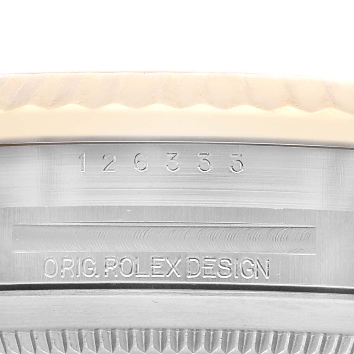 The image shows a close-up of the side of the Rolex Datejust 41 126333 Men's Steel and Gold (two tone) Champagne Dial 126333 Men's Steel and Gold (two tone) Champagne Dial watch, focusing on the engraved model number and "Orig Rolex Design" text.
