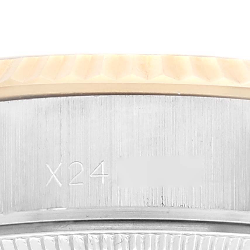 The image shows a close-up of the side case and bezel of a Rolex Datejust 69173 Women's Steel and Gold (two tone) Champagne Dial 69173 Women's Steel and Gold (two tone) Champagne Dial watch.