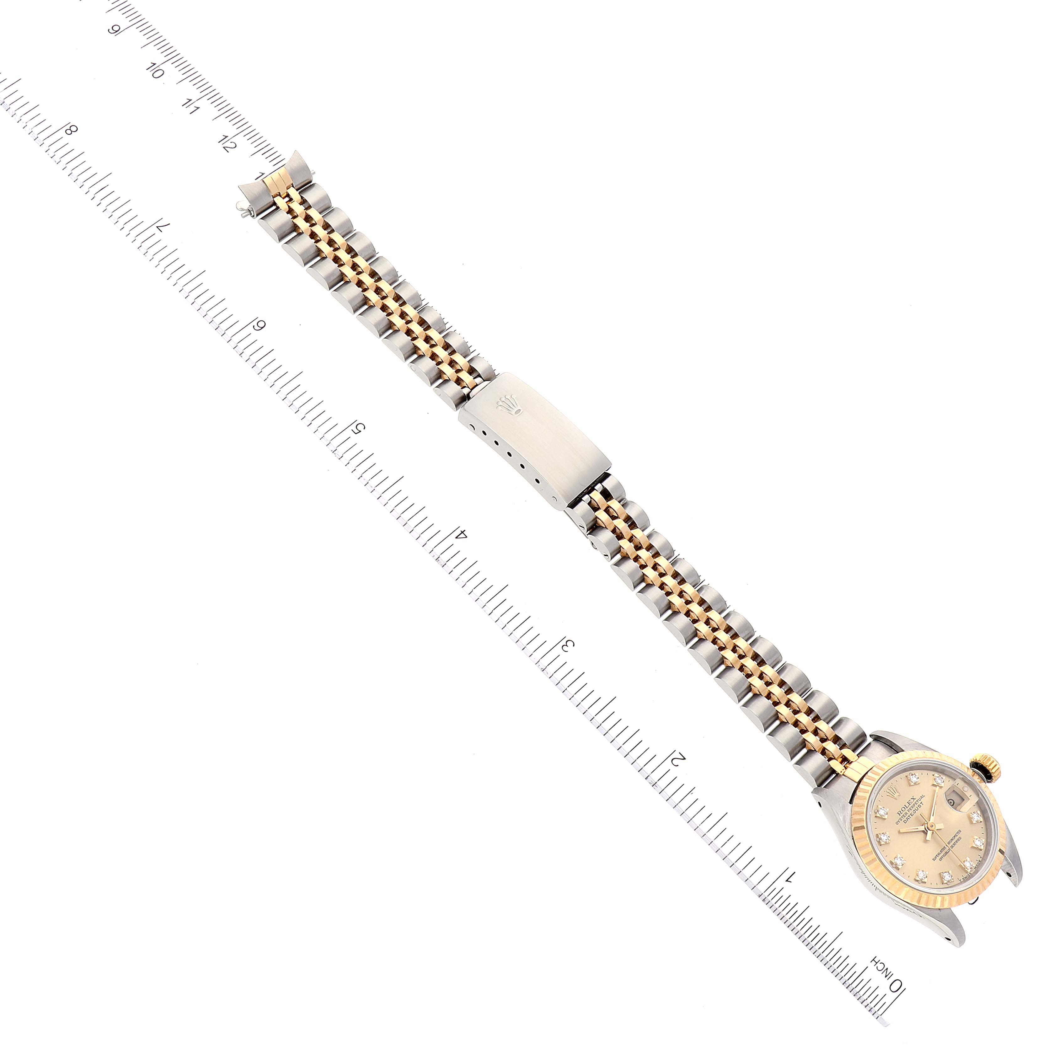The image shows a Rolex Datejust 69173 Women's Steel and Gold (two tone) Champagne Dial 69173 Women's Steel and Gold (two tone) Champagne Dial watch shot from a top-down angle, displaying the face and full length of the two-tone bracelet.