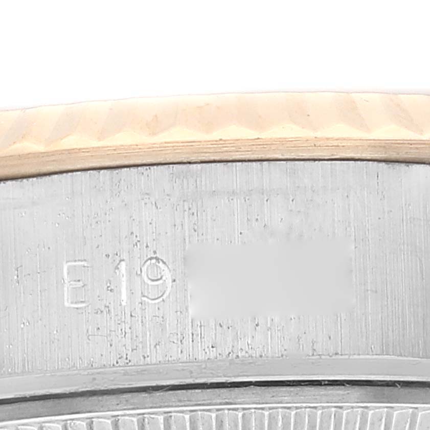 The image shows a close-up view of the serial number engraved between the lugs of a Rolex Datejust 69173 Women's Steel and Gold (two tone) Champagne Dial 69173 Women's Steel and Gold (two tone) Champagne Dial watch.