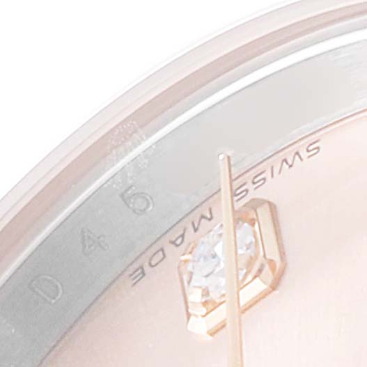 The image shows a close-up of the dial edge and gold-tone hand with a diamond marker of a Rolex Datejust 179171 Women's Steel and Gold (two tone) Pink Dial 179171 Women's Steel and Gold (two tone) Pink Dial watch.