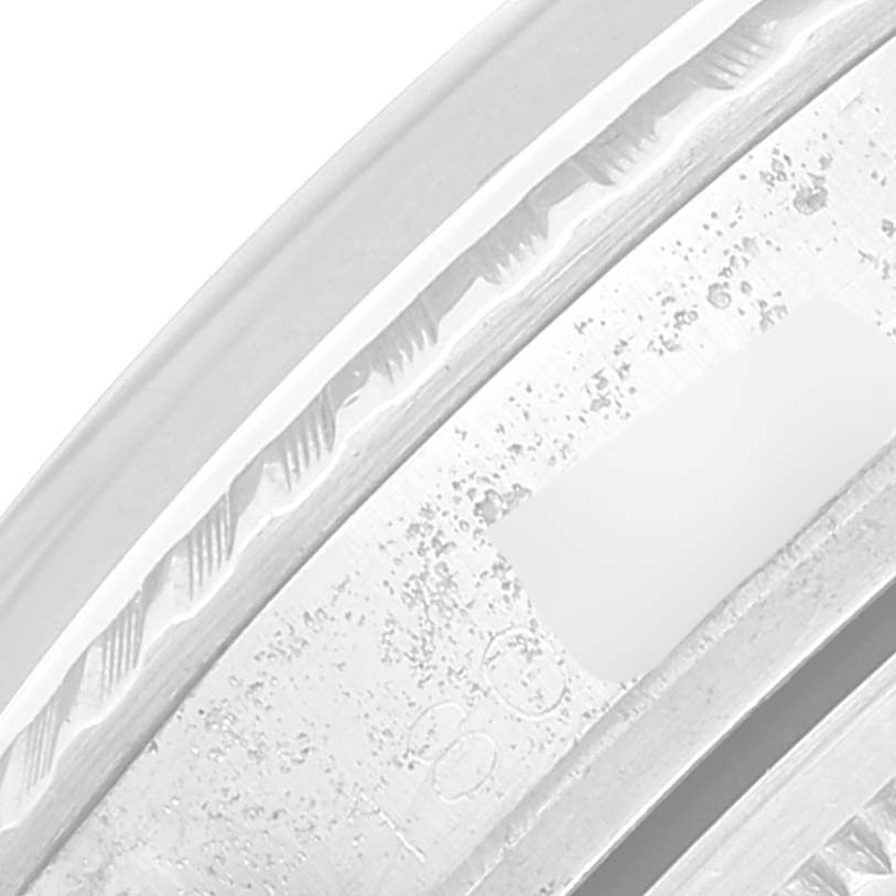 The image shows a close-up angle of the engraved bezel and case of the Rolex Vintage Collection 1603 Men
s Stainless Steel Silver Dial 1603 Men
s Stainless Steel Silver Dial model.