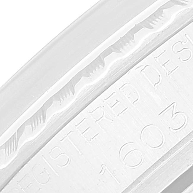 This close-up shot shows the engraved numbers and text on the side of a Rolex Vintage Collection 1603 Men
s Stainless Steel Silver Dial 1603 Men
s Stainless Steel Silver Dial model.