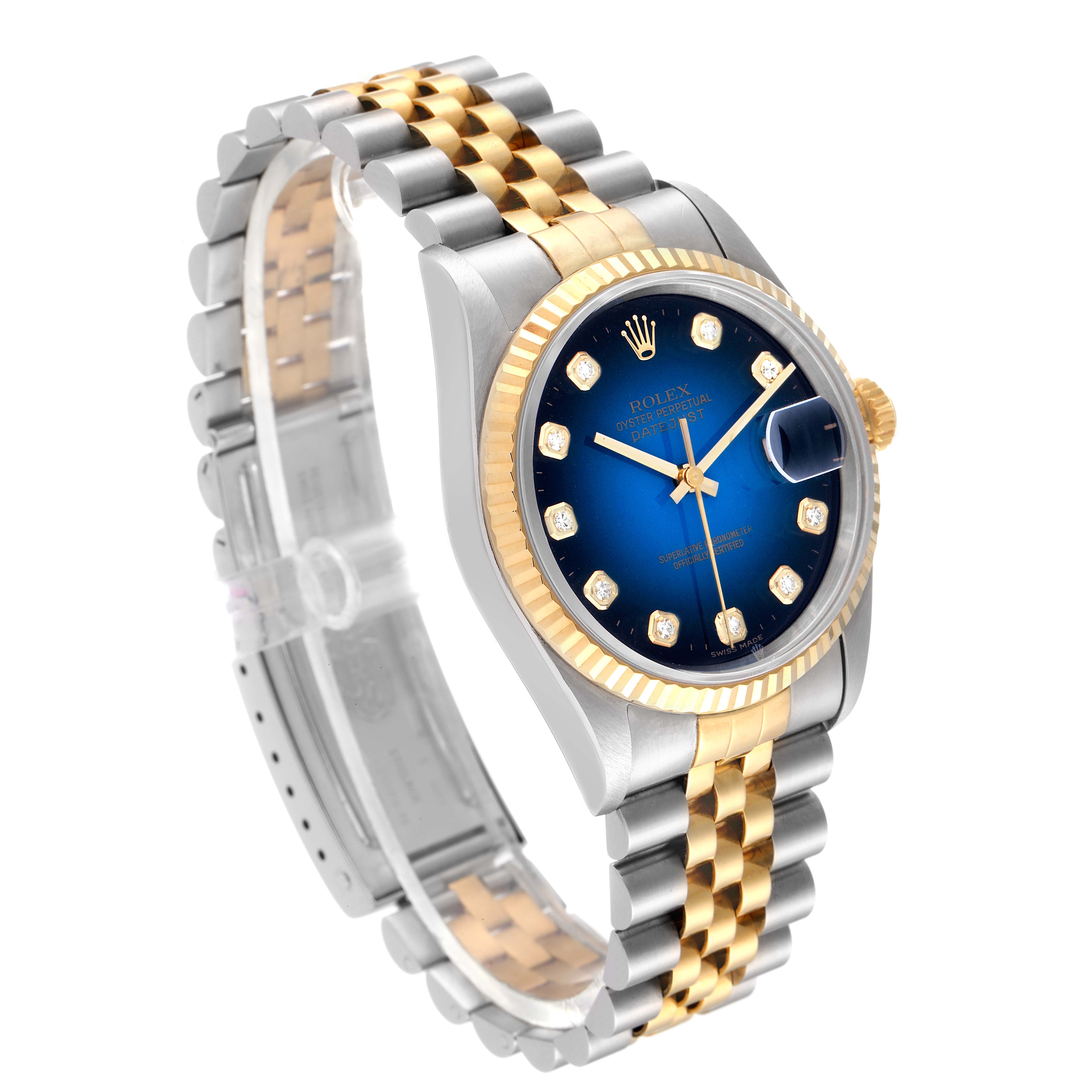 This image shows a Rolex Datejust 16233 Men's Steel and Gold (two tone) Blue Dial 16233 Men's Steel and Gold (two tone) Blue Dial watch angled to highlight its blue dial, gold bezel, and two-tone bracelet.