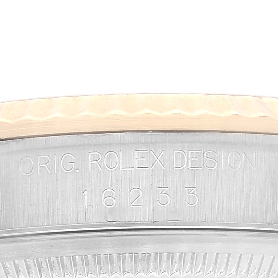 This image shows a close-up of the case side of a Rolex Datejust 16233 Men's Steel and Gold (two tone) Champagne Dial 16233 Men's Steel and Gold (two tone) Champagne Dial watch, highlighting the model number and engraving.