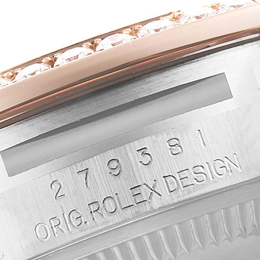 The image shows a close-up of the engraved case and bejeweled bezel of a Rolex Datejust 279381 Women's Steel and Gold (two tone) Pink Dial 279381 Women's Steel and Gold (two tone) Pink Dial watch.