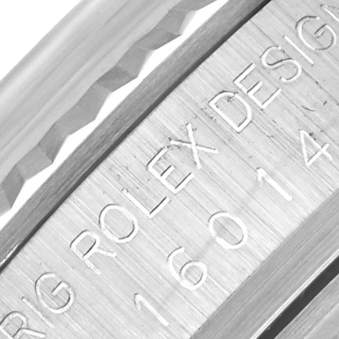 The image shows a close-up of the side of the Rolex Vintage Collection 16014 Men
s Stainless Steel Silver Dial 16014 Men
s Stainless Steel Silver Dial watch, focusing on the engraved model and brand details.