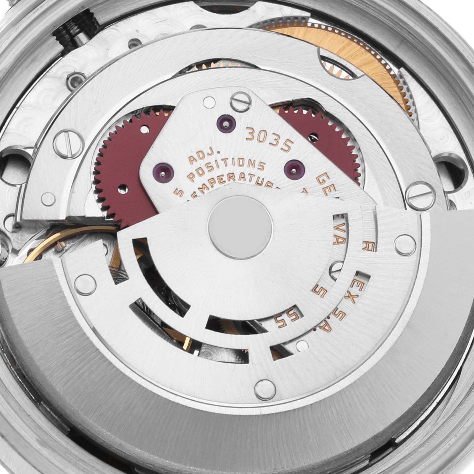 The image shows a close-up of the movement mechanism of a Rolex Vintage Collection 16014 Men
s Stainless Steel Silver Dial 16014 Men
s Stainless Steel Silver Dial watch, detailing gears and rotors.