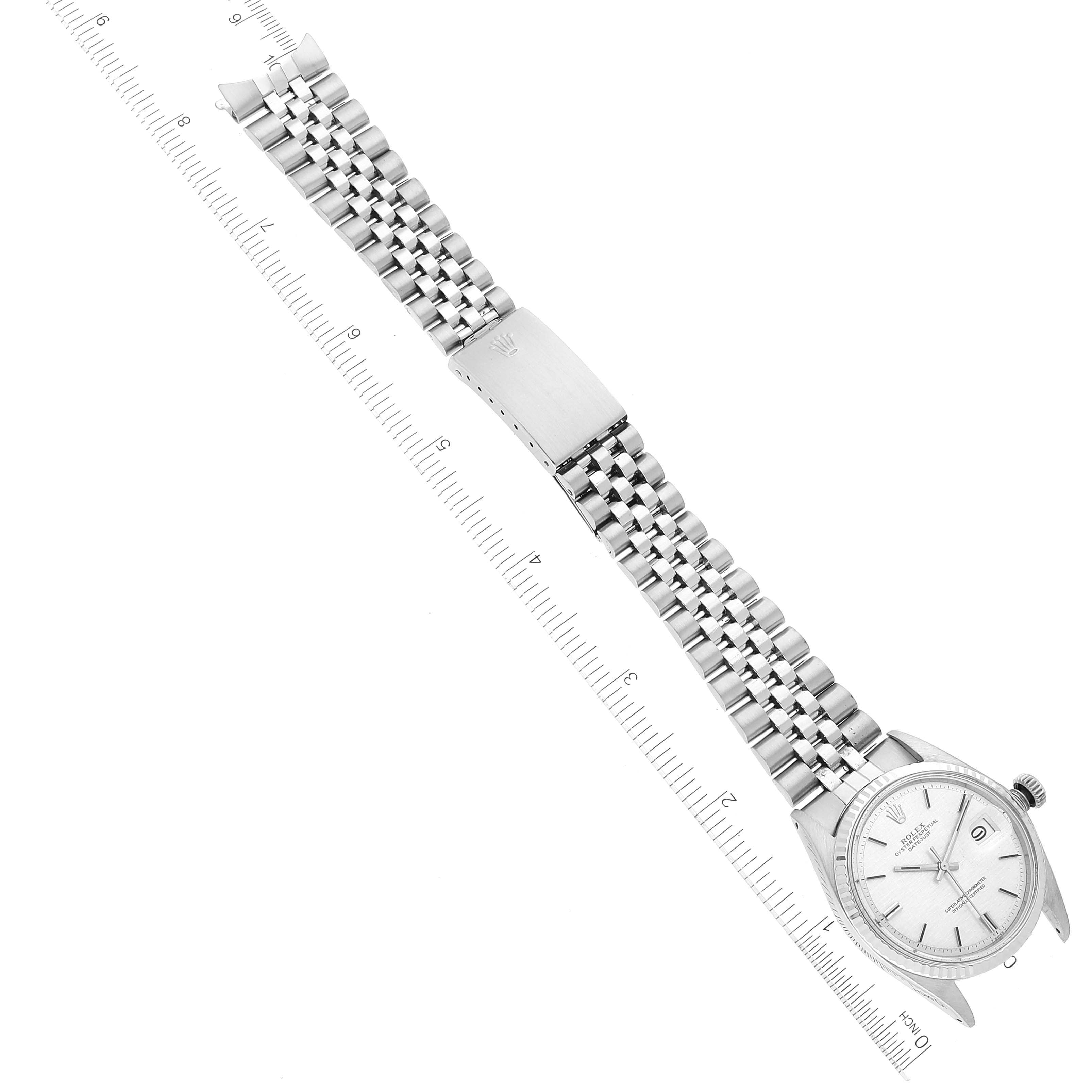 The image shows an overhead view of the Vintage Collection model watch by Rolex, displaying the face, bezel, and band laid flat with a ruler alongside.