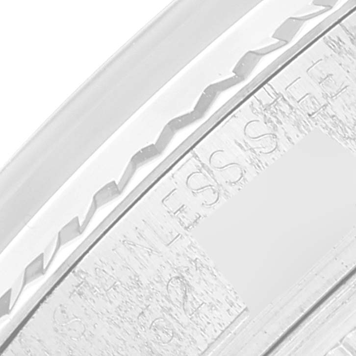 The image shows a close-up of the engraved stainless steel back of a Rolex Vintage Collection 1601 Men
s Stainless Steel Silver Dial 1601 Men
s Stainless Steel Silver Dial watch.