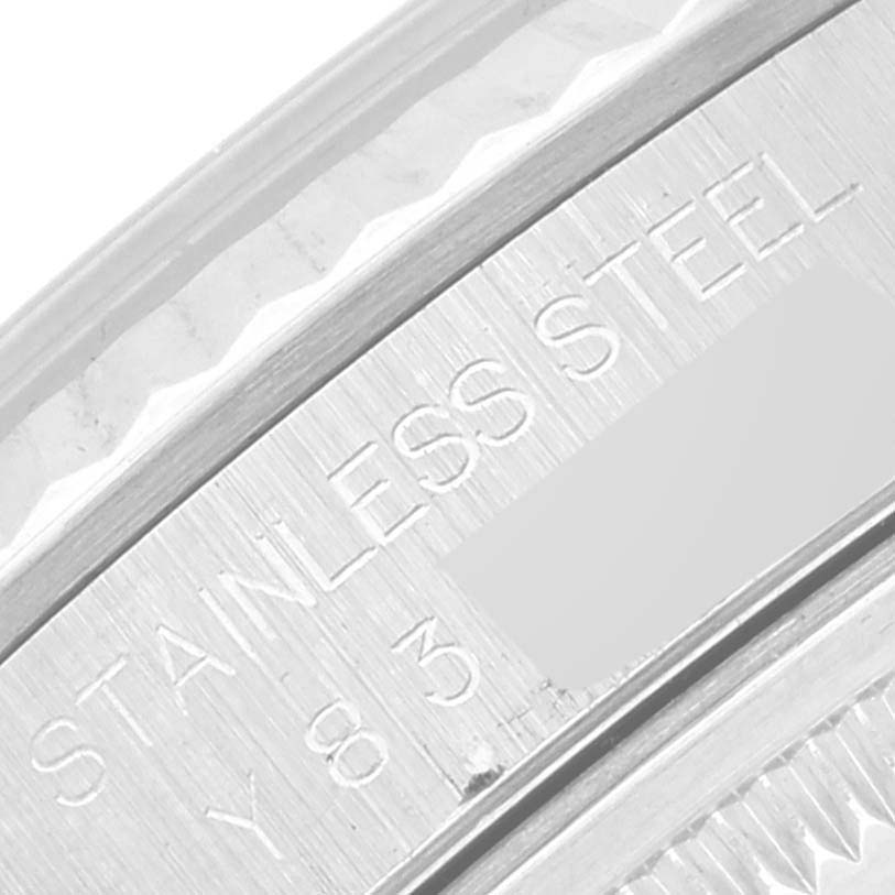This close-up image of the Rolex Datejust 16234 Men's Stainless Steel Silver Dial 16234 Men's Stainless Steel Silver Dial watch shows the engraving on the stainless steel case.