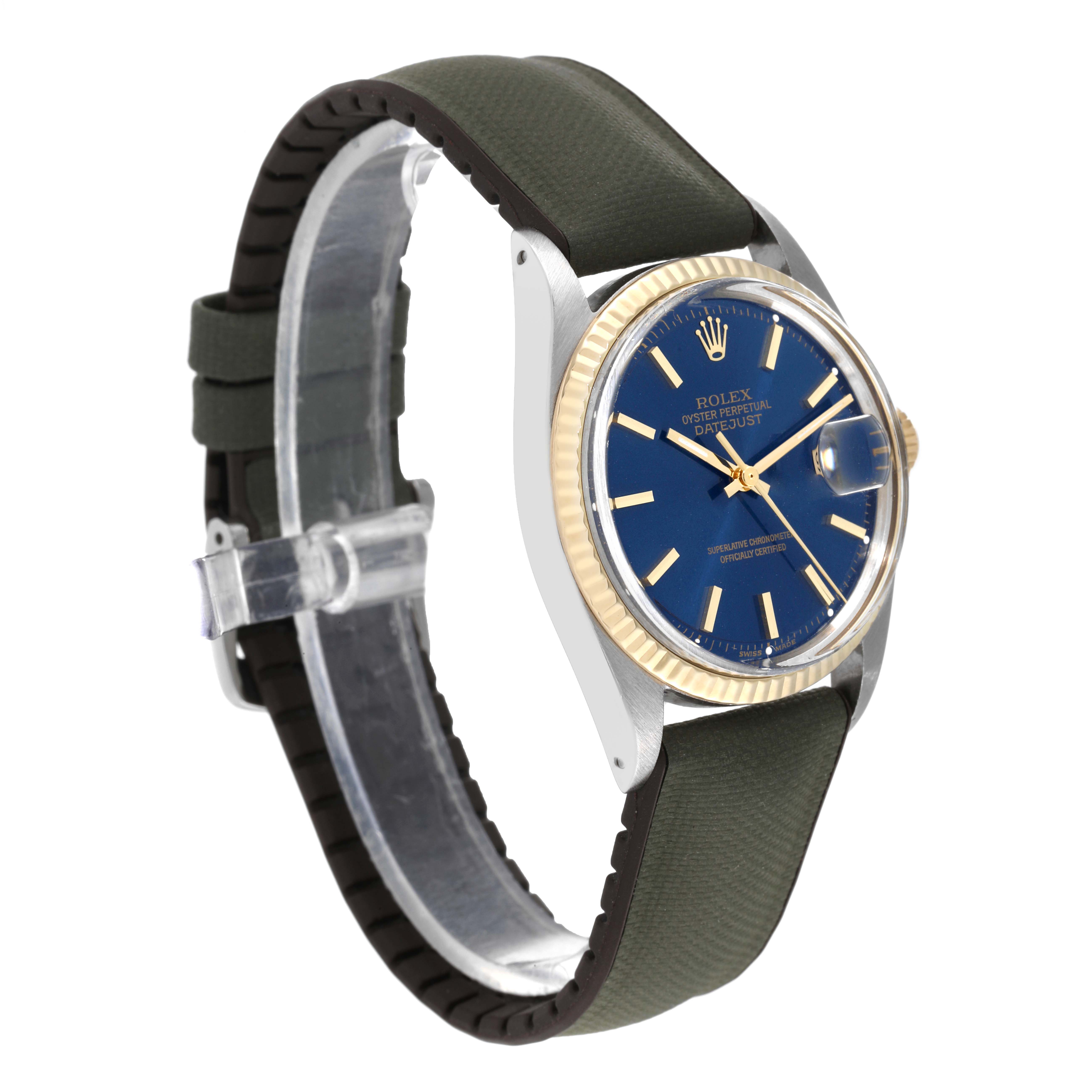 The Rolex Vintage Collection 1601 Men's Steel and Gold (two tone) Blue Dial 1601 Men's Steel and Gold (two tone) Blue Dial watch is shown at a slight angle, displaying its blue dial, gold bezel, and green strap.