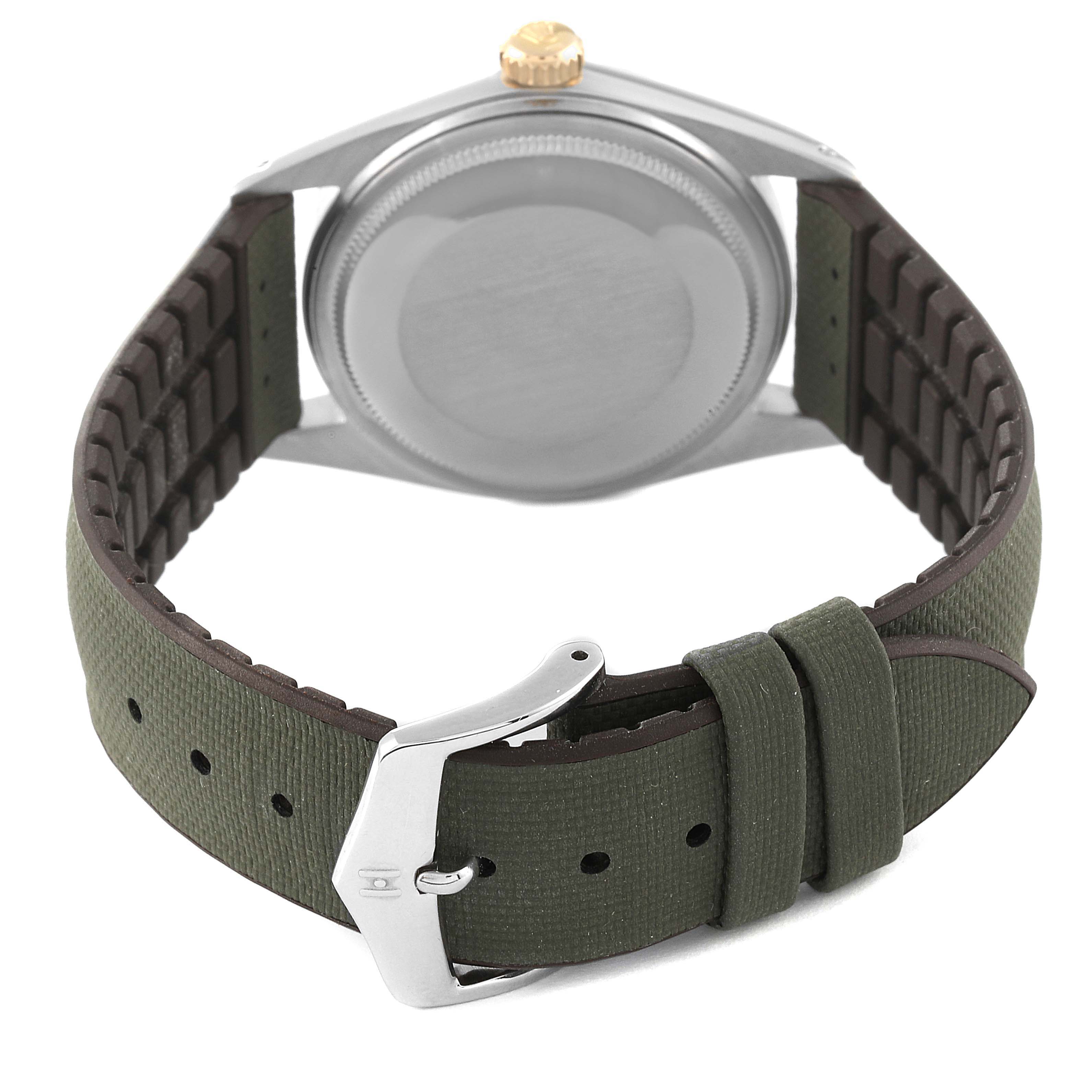 The image shows the back of a Vintage Collection Rolex watch, highlighting the case back, strap, and clasp.