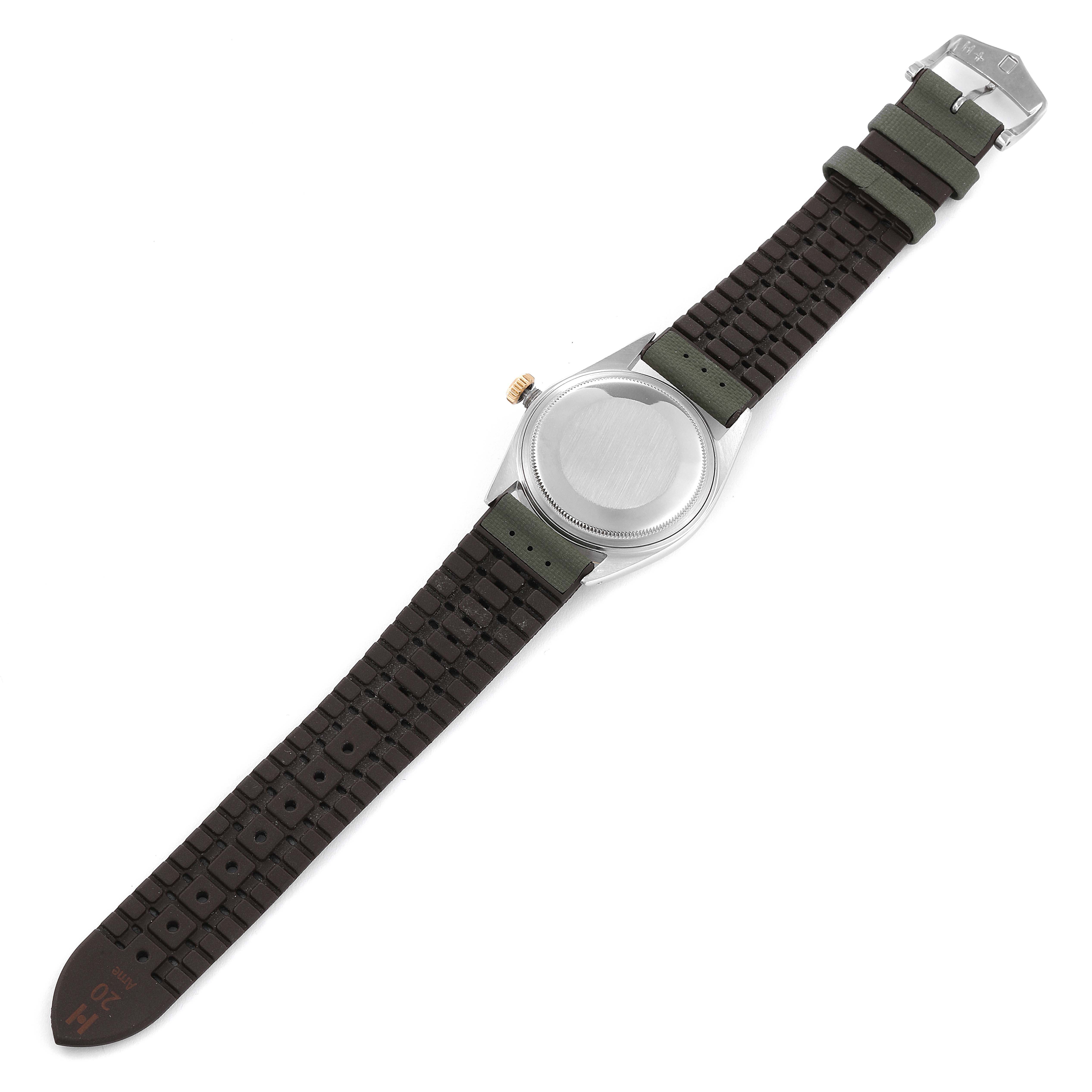 The image shows the back view of a Rolex Vintage Collection 1601 Men's Steel and Gold (two tone) Blue Dial 1601 Men's Steel and Gold (two tone) Blue Dial watch with its strap fully laid out.