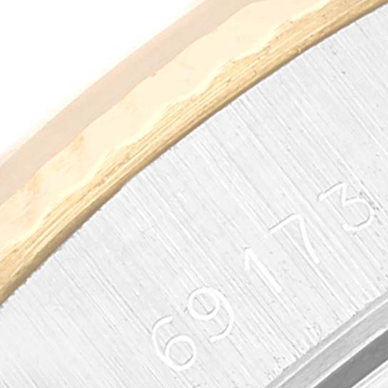 Close-up angle showing the serial number engraving on the case of the Rolex Datejust 69173 Women's Steel and Gold (two tone) Champagne Dial 69173 Women's Steel and Gold (two tone) Champagne Dial watch.
