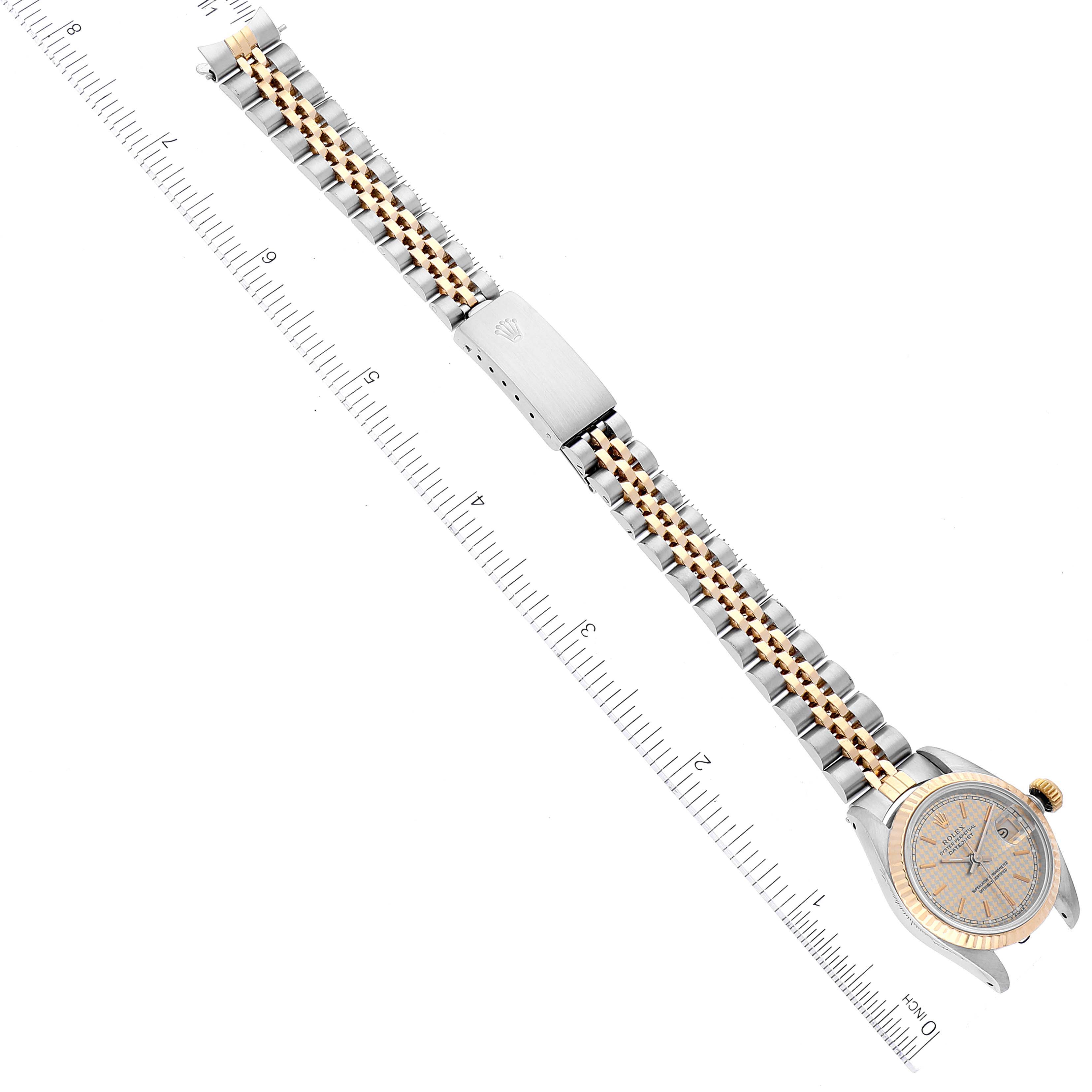 The image shows an overhead view of a Rolex Datejust 69173 Women's Steel and Gold (two tone) Champagne Dial 69173 Women's Steel and Gold (two tone) Champagne Dial watch, displaying its full bracelet and part of the watch face.
