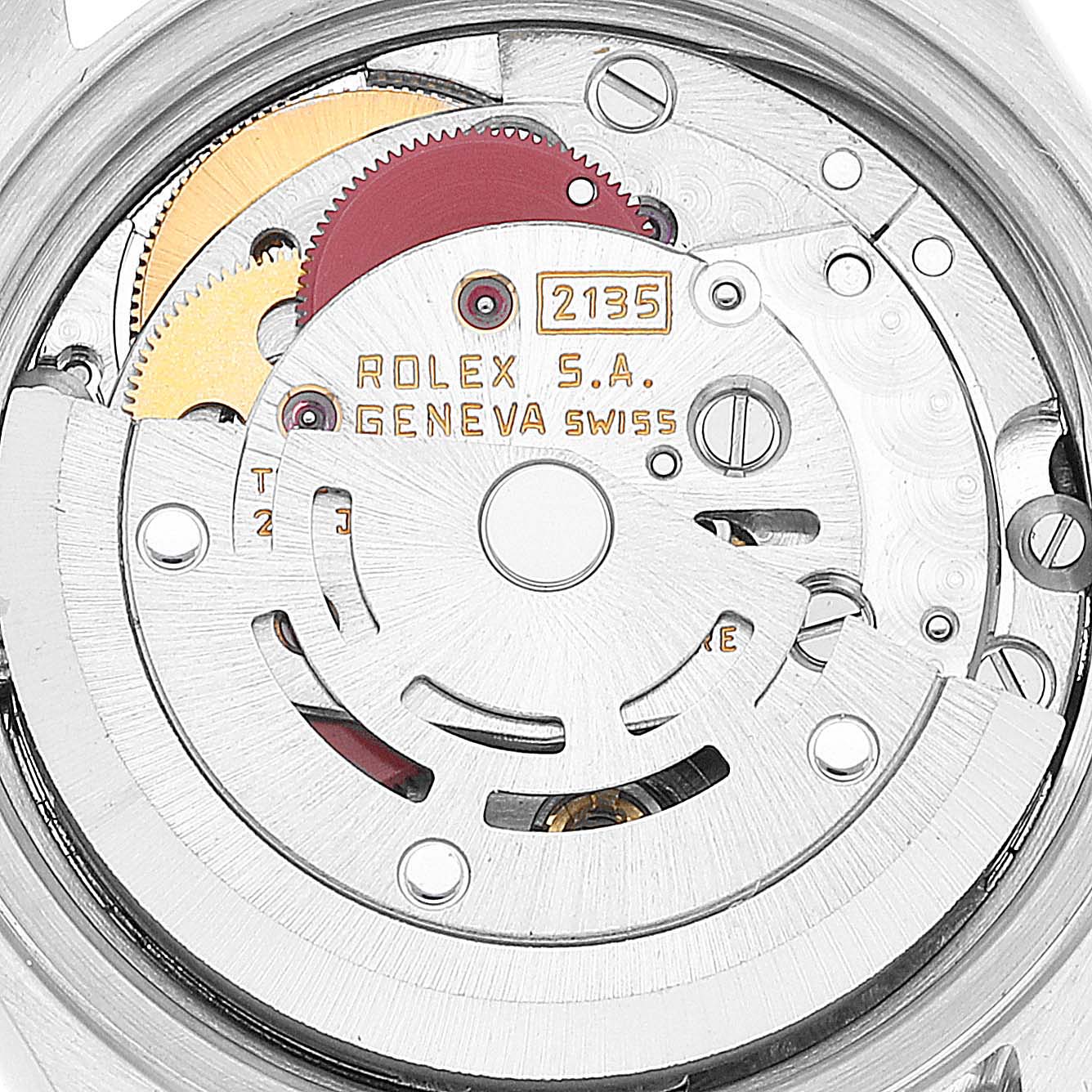 The image shows a close-up of the movement mechanism of a Rolex Datejust 69173 Women's Steel and Gold (two tone) Champagne Dial 69173 Women's Steel and Gold (two tone) Champagne Dial watch, highlighting its internal components and engravings.