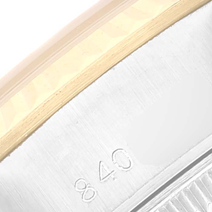 This close-up image of the Rolex Datejust 69173 Women's Steel and Gold (two tone) Champagne Dial 69173 Women's Steel and Gold (two tone) Champagne Dial watch shows part of the bezel and engraved numbers on the case.