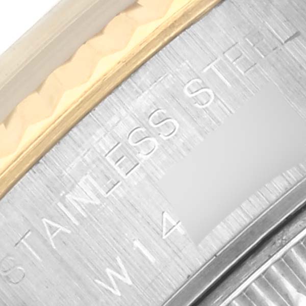 The image shows a close-up of the engraved bezel edge of a Rolex Datejust 69173 Women's Steel and Gold (two tone) Champagne Dial 69173 Women's Steel and Gold (two tone) Champagne Dial, highlighting the "Stainless Steel" inscription.