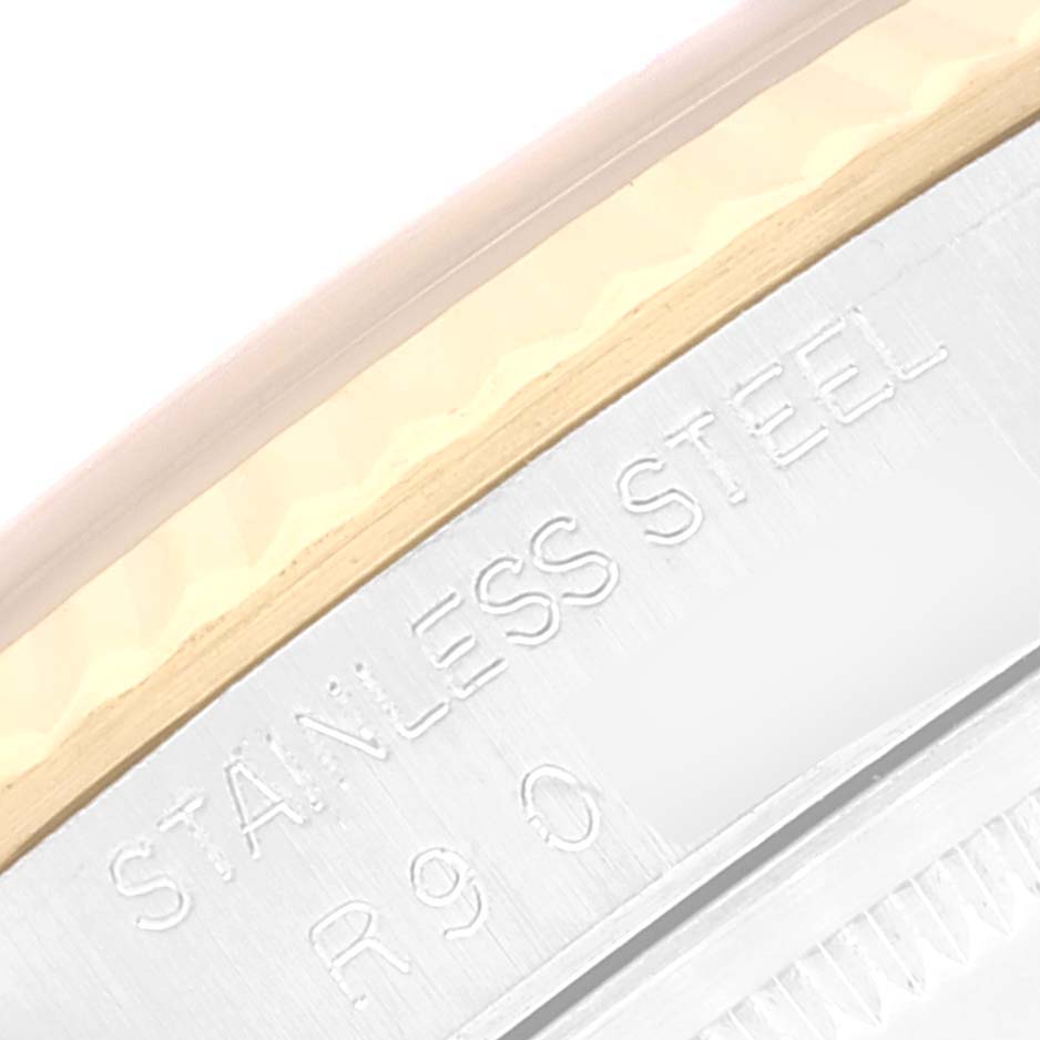 The image shows an up-close view of the side of a Rolex Datejust 16233 Men's Steel and Gold (two tone) Beige Dial 16233 Men's Steel and Gold (two tone) Beige Dial watch, highlighting the "STAINLESS STEEL" engraving.