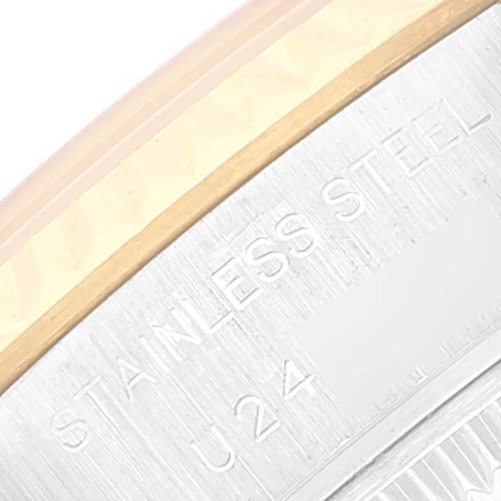 A close-up of the side of the Rolex Datejust 69173 Women's Steel and Gold (two tone) Beige Dial 69173 Women's Steel and Gold (two tone) Beige Dial watch case showing the "STAINLESS STEEL" engraving.