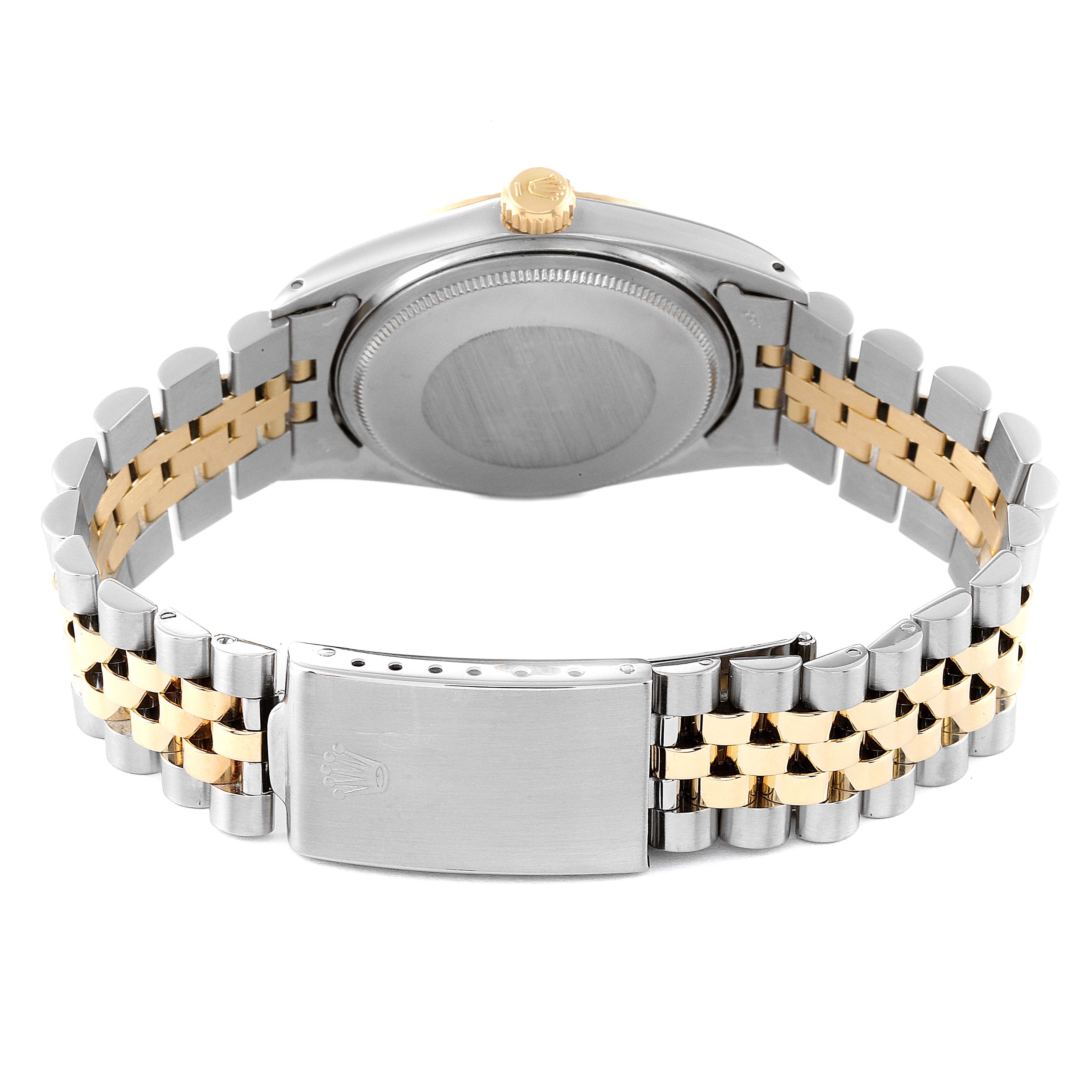 This image shows the back and band of a Rolex Vintage Collection 1601 Men's Steel and Gold (two tone) Silver Dial 1601 Men's Steel and Gold (two tone) Silver Dial watch, featuring a silver and gold two-tone bracelet.
