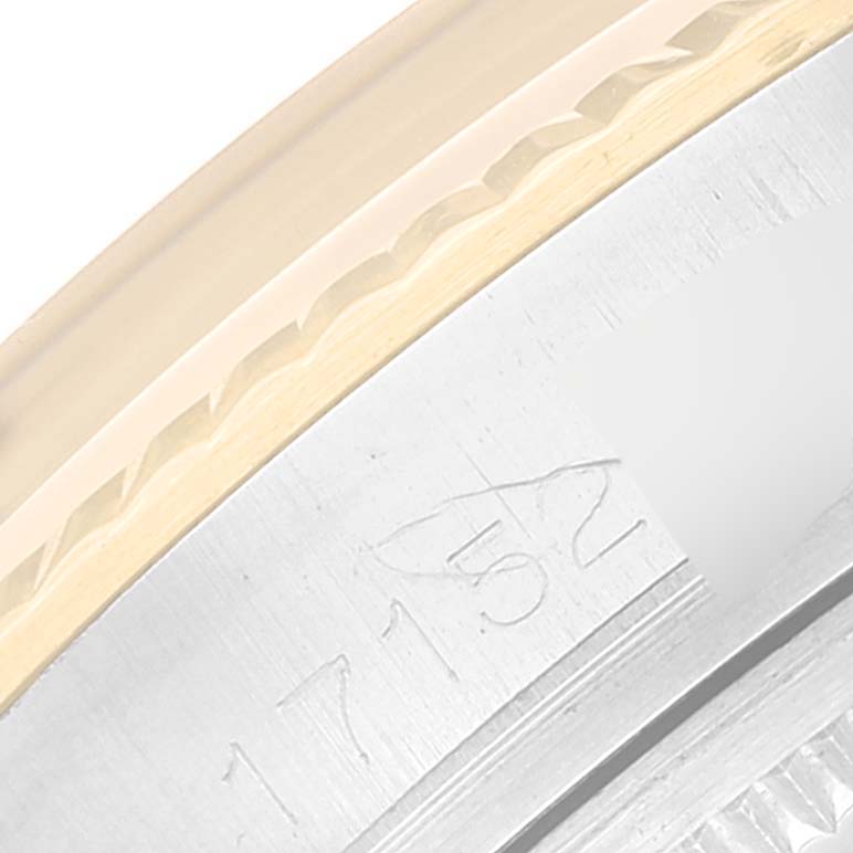 This close-up image of a Vintage Collection Rolex watch shows the serial number engraving on the watch case.