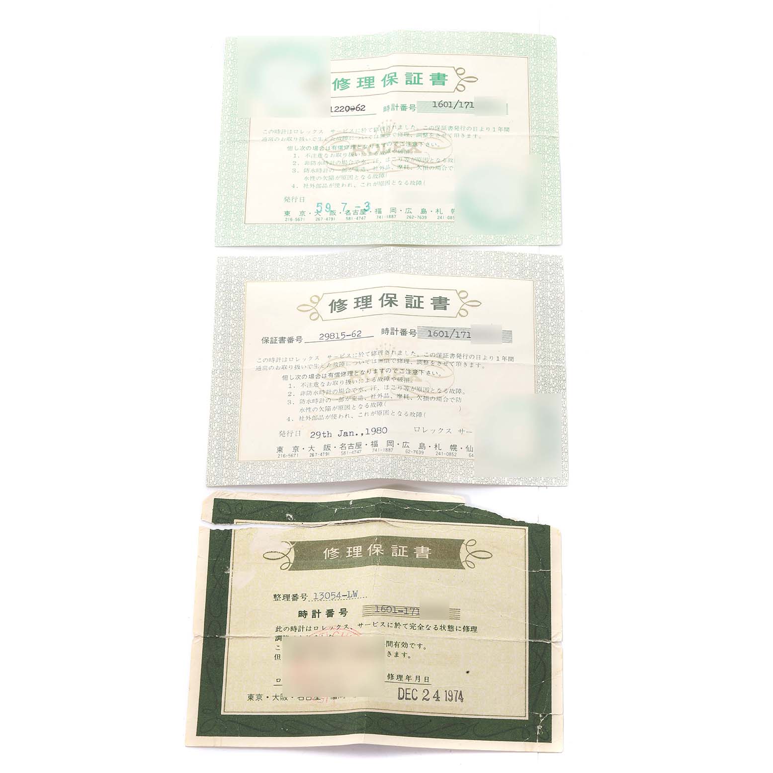 The image shows the guarantee cards and documentation for the Vintage Collection model by Rolex, viewed from the top.