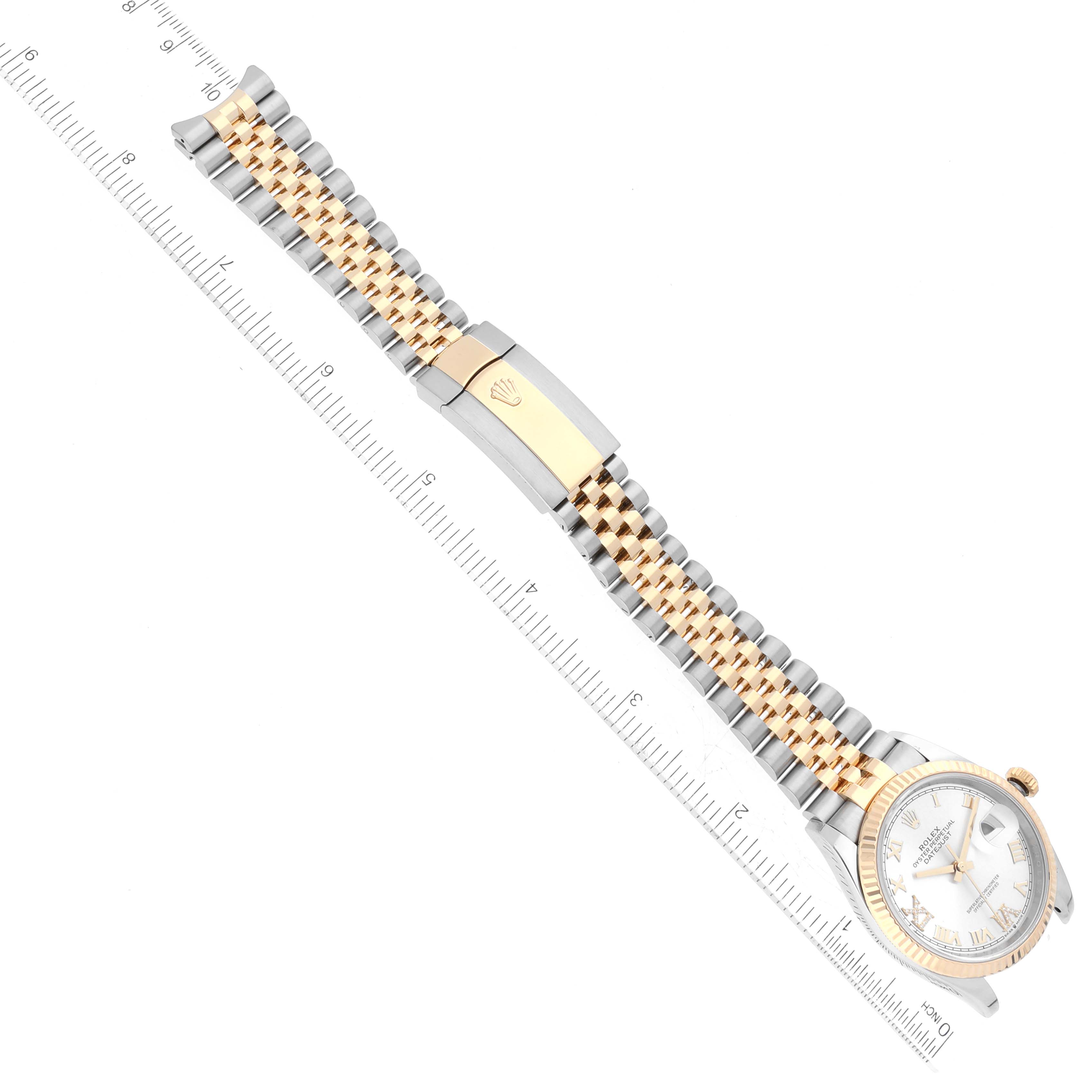 The image shows an angled top-down view of a Rolex Datejust 126233 Men's Steel and Gold (two tone) Silver Dial 126233 Men's Steel and Gold (two tone) Silver Dial watch with a two-tone bracelet and a partially visible dial.