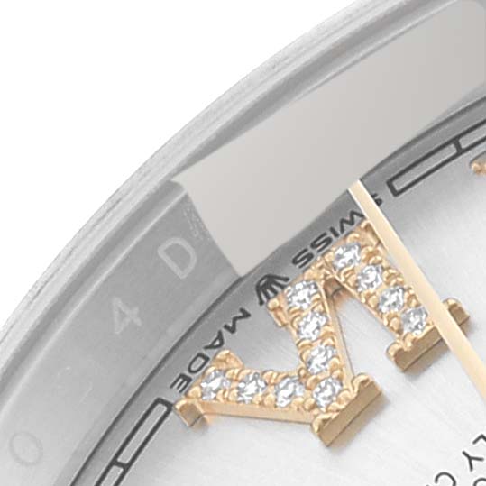 The image shows a close-up of the dial and diamond hour marker of a Rolex Datejust 126233 Men's Steel and Gold (two tone) Silver Dial 126233 Men's Steel and Gold (two tone) Silver Dial watch, highlighting the "SWISS MADE" text and part of the date indicator.
