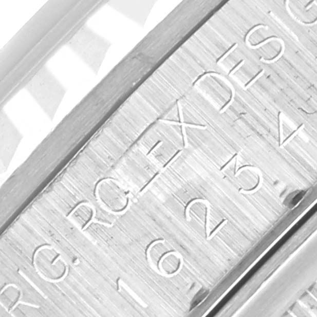The image shows an up-close view of the engraved inner bezel (rehaut) of a Rolex Datejust 16234 Men's Stainless Steel White Dial 16234 Men's Stainless Steel White Dial.
