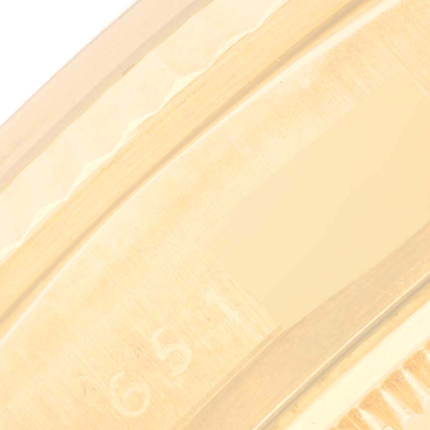 The image shows a close-up of the side of the Rolex Vintage Collection 16018 Men's Yellow Gold Champagne Dial 16018 Men's Yellow Gold Champagne Dial watch case, highlighting the engravings.